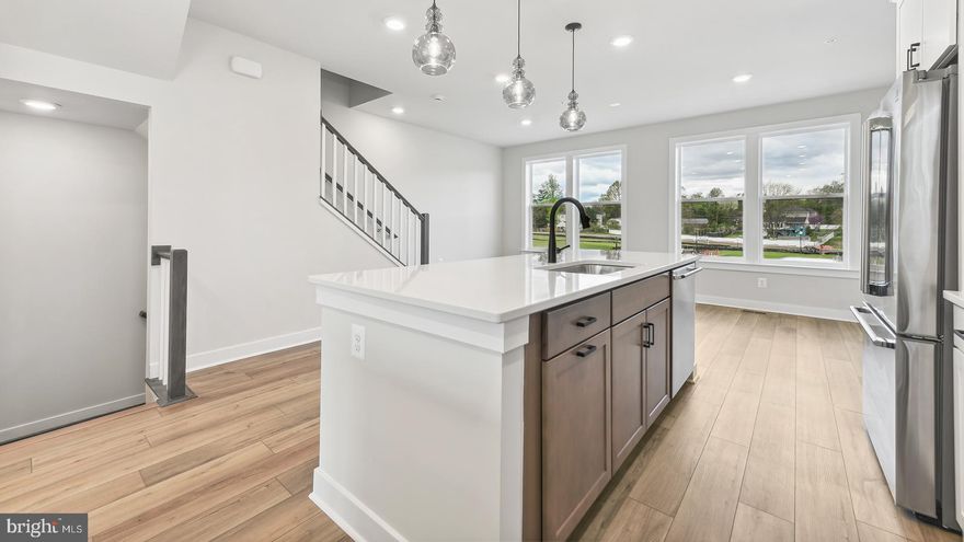 *OFFERING UP TO 20K IN CLOSING COST ASSISTANCE WITH USE OF PREFERRED LENDER AND TITLE.*
 Beautifully designed 4-level Cary townhome boasting over 2,600 Sq. Ft. of living space and a 2-car rear-load garage. As you step inside, you’re welcomed by a spacious foyer that opens to a lower-level bedroom and full bathroom. Ascend the oak stairs to the main living space, where you’ll find the centrally located gourmet kitchen featuring stainless steel appliances, a pantry, upgraded cabinetry, quartz countertops, and a spacious island. The kitchen seamlessly opens to the dining room and the family room, which offers direct access to the rear deck. Continue to the third floor to find a retreat in the primary suite, offering a spacious walk-in closet and a private bathroom featuring a dual sink vanity with quartz countertops and a walk-in shower. Two additional bedrooms, a hall bathroom with quartz countertops, and a conveniently located laundry room complete the third level. The fourth level features a bedroom, full bathroom, and a spacious loft with wet bar that opens to a large rooftop terrace, providing an ideal space for outdoor living. Located in Northfax West near the intersection of Route 123 and Route 50, this new construction home offers convenience and luxury in a prime location *Photos may not be of actual home. Photos may be of similar home/floorplan if home is under construction or if this is a base price listing.