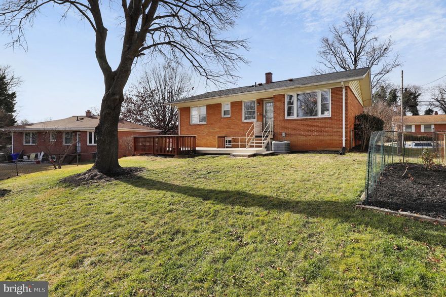 *OFFER DEADLINE: MONDAY, 01/15 @ 5:00 PM - PLEASE SUBMIT ALL OFFERS BY DEADLINE* Welcome to this exquisite all-brick rambler style home with private driveway that seamlessly blends classic charm with modern updates. This 3-bedroom, 2.5-bathroom residence, with FRESHLY PAINTED rooms, boasts a perfect fusion of timeless elegance and contemporary convenience, making it an ideal haven for the discerning buyer.  As you enter through the foyer, the NEWLY REFINISHED hardwood floors pave the way throughout a meticulously designed interior. The living room and dining room, also adorned with gleaming hardwoods, sets the stage for intimate gatherings, while the step-down living room adds an extra touch of sophistication to this welcoming space. The kitchen, featuring BRAND NEW granite counters, vinyl flooring, also includes a newer oven range for the aspiring chef. With electric cooking and a convenient door leading to the expansive backyard deck, this kitchen is both functional and stylish. All three spacious bedrooms on the main level also feature gleaming hardwoods and the primary bedroom includes a ceiling fan and walk-in closet, as well as an ensuite full bath with updated vanity, which completes this tranquil retreat. There's also a half bath with updated vanity and linen closet in the main hall. The walk-up lower level boasts a thoughtfully designed recreation room with BRAND NEW wall-to-wall carpet, crown molding, and newer windows that bathe the space in natural light. The lower level also features a guest room with BRAND NEW carpet and closet, as well as a full bathroom featuring ceramic tile floors and a single vanity, providing comfort and convenience for residents and guests alike. For additional versatility, the storage space underneath and adjacent to the stairway linoleum tile floor and shelving also add to the functionality of this level and the unfinished storage room includes a washer and dryer, as well as an additional refrigerator and freezer. Beyond the walls of this enchanting home lies a backyard oasis with lush gardens, large deck and two flourishing fig trees. The chain-link fenced yard, featuring two gates, ensures privacy and security while providing a perfect space for outdoor enjoyment. The BRAND NEW ROOF was just installed. This residence is not just a home; it's a lifestyle. Immerse yourself in the charm of all-brick architecture, the warmth of fresh paint and refinished hardwood floors, and the allure of modern amenities. Welcome to a place where timeless elegance meets contemporary living—welcome home. Schools, parks, shopping, restaurants and Metro close by. NOTE: THIS ESTATE SALE PROPERTY IS BEING SOLD IN AS-IS CONDITION.