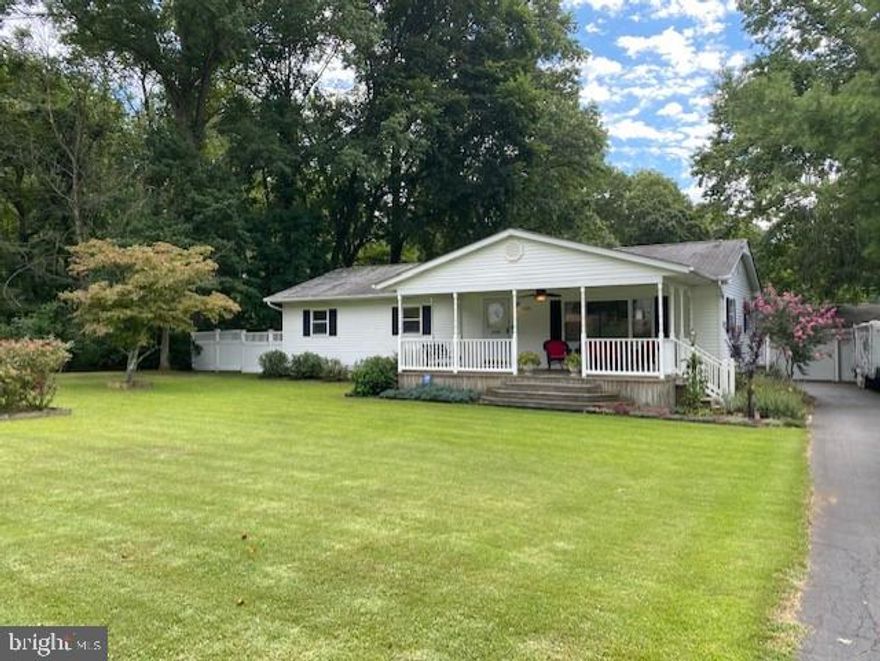 Well maintained Rancher with Expansive Covered Front Porch nicely situated on Private ½ acre lot, with no HOA.  Close to town, shopping, dining, and recreation.  Beautiful Hardwood Floors Welcome you home to this Traditional Rancher with Bonus Family Room/Sunroom with Pellet Stove just off Large Kitchen complete with appliances and Breakfast Bar Open to the Breakfast/Dining Area.  Primary Bedroom with ½ bath and walk in closet.  2 Additional good-sized bedrooms all offer single level living.  Walk out to your Terrific Back yard with above ground pool with deck surround.  Incredible 4 car garage with built in cabinetry and workbench perfect for the car enthusiast, hobbyist, or recreation lover, Complete with water & electric. You won’t find another garage with this square footage and usability at this price in the area.  Don’t delay, schedule your viewing appointment today.