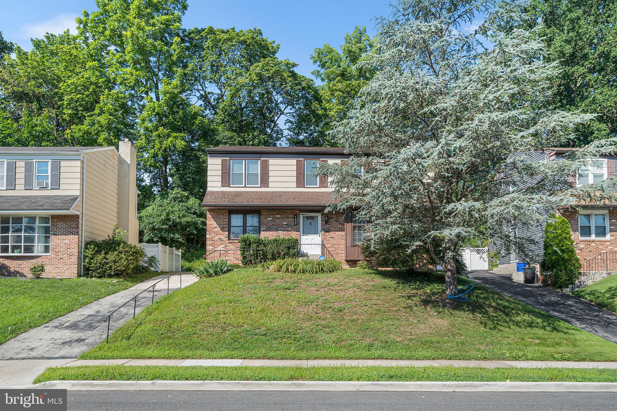 Welcome to 142 Foster Avenue, a beautifully updated 4-bedroom, 2.5-bathroom colonial set on a quiet, elevated street in one of Havertown’s most desirable neighborhoods—just minutes from parks, dining, and top-rated schools in the Haverford School District. Step inside to find a classic center-hall layout, thoughtfully modernized with refinished hardwood floors, renovated bathrooms, and a bright, fully updated kitchen featuring quartz countertops, shaker-style cabinetry, and stainless-steel appliances. The main level offers an ideal flow for everyday living and entertaining, with a spacious living room, formal dining room, and a cozy den or flex space perfect for a home office or playroom. Upstairs, you’ll find four well-proportioned bedrooms, including a sunlit primary suite with a renovated en-suite bath, along with a second full bath and ample closet space throughout. Out back, enjoy elevated views from your private deck, perched above a sloped backyard that offers green space without the upkeep. Whether you’re grilling on summer evenings or sipping coffee on crisp fall mornings, the deck provides the perfect extension of your living space—low maintenance and full of potential. Additional features include a partially finished basement, central air, and a private driveway. Walkable to popular shops and restaurants, Haverford Reserve, and multiple township parks, this home is ideal for those seeking timeless character with modern updates in a tight-knit, walkable community.