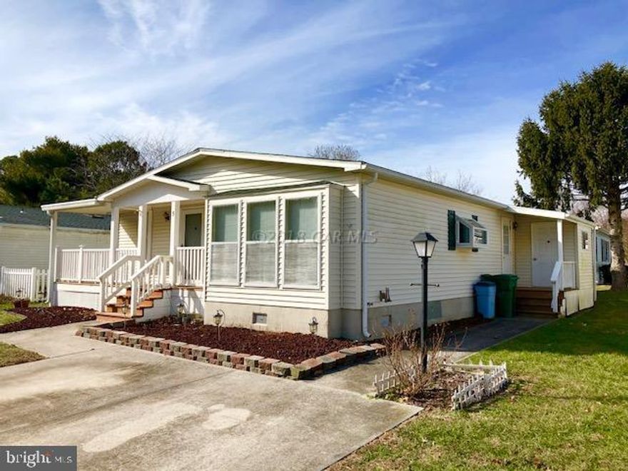 Spacious 2 bedroom, 2 bath with large sunroom in popular West OC community just minutes to the Ocean City beach and boardwalk, Assateague Island, Town of Berlin, and Outlets. Homeowners Association dues include grass cutting and trash pickup. Amenities include Olympic sized outdoor pool, tennis courts, and boat and trailer storage.   NO CITY Taxes.