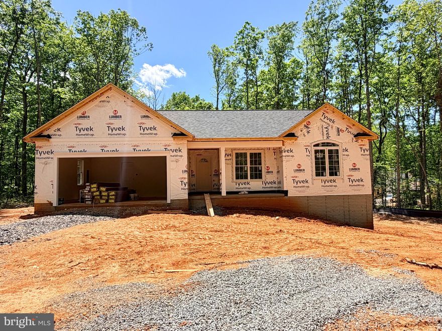 UNDER CONSTRUCTION! CHARLESTON II MODEL - LOT 1- Located on a lovely 2.97 acre mostly wooded lot. Home will include an open floor plan with Stainless Steel Appliances and Granite Counter Tops in kitchen, Cultured marble vanity tops in the bathrooms, Covered front porch, Unfinished Basement with bathroom rough-in for future expansion and a 2 car garage. Call for more information or to schedule a showing! Road Maintenance Agreement. MID JULY COMPLETION DATE!