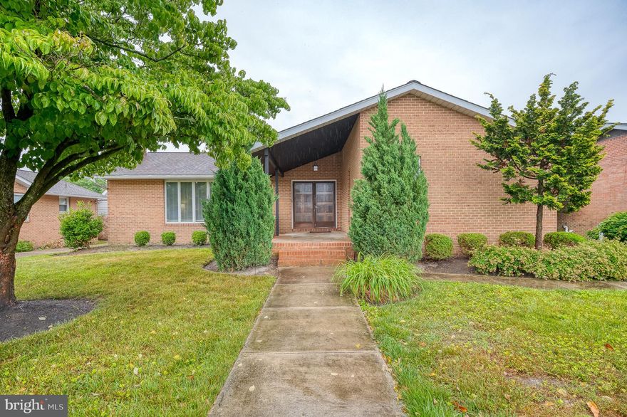 This is the Perry Hall - Nottingham Rancher you have been waiting for!  This stately solid brick home has a covered porch entry with french doors that open to the foyer.   Hardwood floors on main living area with vaulted ceilings and exposed beams and wood burning fireplace.  The kitchen offers white cabinets, recessed lighting, stainless steel appliances & quartz counters with breakfast bar & casual dining room. Access to the covered back porch from the oversized sliders in dining room or the door in the kitchen to the fully fenced backyard, and huge concrete patio for all your cookouts.  There are two bedrooms and an updated hall bath.  The primary bedroom offers a full bath and walk-in closet. The partially finished lower level has a laundry room, clubroom, ample storage, and half bath. This one is going to wow you with the best backyard in the neighborhood!