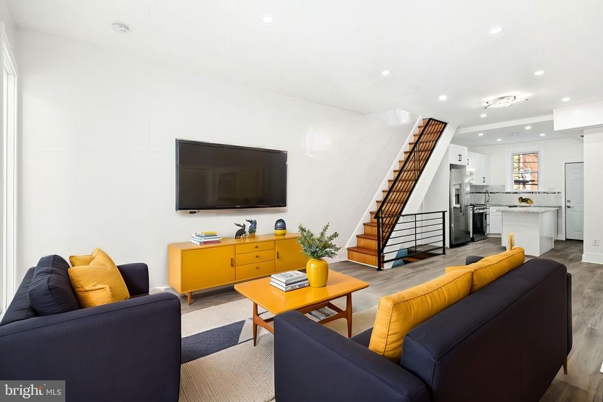 ***HOME QUALIFIES FOR GRANTS & NO PMI for buyer that qualify ***Welcome to 1411 S Paxon Street, a fully rehabbed gem in the high-demand neighborhood of Kingsessing Philly! Known for its rich history, strong community, and exciting growth, Kingsessing offers a prime location for first-time homebuyers or real estate investors seeking rental opportunities. This home has been thoughtfully updated with new central heating and air, a new roof, a brand-new deck, and stylish interior finishes. Step into the newly enclosed porch—ideal for a home office or mudroom setup—and enjoy the open-concept design of the spacious living and dining areas. The interior showcases wide plank hardwood floors, fresh paint, and a stunning new kitchen featuring white shaker cabinets, granite countertops with gray flecks, matte black hardware, and a modern tile backsplash with a black accent stripe. Beyond the kitchen, the new Trex deck provides the perfect space for year-round grilling and outdoor entertaining. One of the home’s standout features is the sleek black metal railings leading to the second floor, where you'll find two inviting bedrooms and a beautifully updated full bathroom. The fully finished basement adds versatility, offering space for a third bedroom, office, or media room. It also includes a second full bathroom and a new Samsung washer and dryer. Situated in a Walk Score 85 and Transit Score 81 area, this home is conveniently located near Woodland Avenue, several bus and trolley lines, and offers quick access to University City, Drexel University, USciences, local parks, and the highly regarded Independence Charter School West. *For eligible buyers, the home qualifies for BANK GRANTS and no PMI mortgage programs, making it an even smarter investment.* Don’t miss this opportunity to own a stylishly updated home in a high-traffic, rapidly appreciating area.