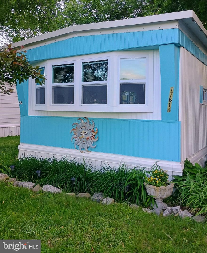 Seller is motivated.  Bring an offer. Discover this well-maintained single wide mobile home, perfect as a summer retreat or year-round living. Situated under mature trees that provide wonderful shade, this home offers a serene setting with views of the community pool and an open field in the foreground.
Inside, you’ll find a bright and inviting living space that smells fresh and has been carefully cared for. The home features two medium-sized bedrooms connected by a convenient Jack-and-Jill half bath, while the primary bedroom is privately located on the opposite end of the home for added comfort.
A new AC unit, installed just five years ago, ensures you’ll stay cool during warmer months. The home boasts a sturdy metal roof, giving you peace of mind.
The entry is through the spacious screen porch, which opens into the center of the home, perfect for relaxing or enjoying the breeze. There’s also a large shed in the backyard, offering ample storage for all your seasonal items and tools.
Don’t miss this opportunity to own a lovely home in a fantastic location!  Park approval is required.  Home is being sold AS IS.