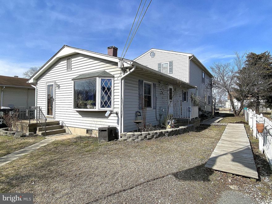 This is the perfect opportunity to own an extra large home in the Sparrows Point area at a spectacular price.  Located only block from the water in the Jones Creek area.  Bring your ideas and transform this massive home in to your dream home.  Currently set up with an in-law suite but could easily be turned in to a 7 bedroom, 2.5 bath single home.  The first floor features 3 bedrooms 1.5 bathrooms with a large living room, den, dining area, kitchen and breakfast area.  The second level, with a separate entrance, has 3 bedrooms  plus den (4th bedroom), living room, kitchen, bathroom and laundry hook up.  If you love the outdoors, you will love this spacious yard, along with the deck, above ground pool, shed and a one car garage. There is plenty of room for parking with the driveway and the parking area in front of the house.