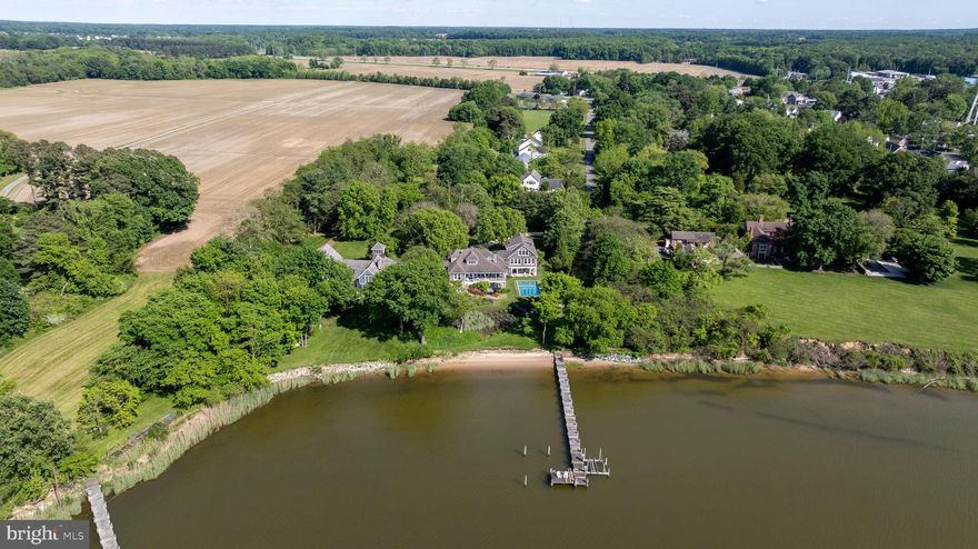 Welcome to your dream waterfront oasis on Little ​Queenstown Creek, just off the Chester River. This ​stunning property boasts 5 bedrooms and 7.5 ​bathrooms, perfect for accommodating family and ​guests in style. As you step inside, you'll be ​captivated by the open floor plan that showcases ​breathtaking water views from nearly every room in ​the house. The main floor features a spacious ​primary suite, offering a serene retreat with its own private views of the creek. The gourmet kitchen is a chef’s delight, featuring a large island, stainless steel ​appliances, a Viking gas stove, and a range hood, making meal preparation a joy. The upper level offers ​an additional spacious primary suite, providing a private haven for relaxation. The lower level is designed ​with guests in mind, offering a comfortable family room with a kitchenette and an en-suite bedroom. ​Additionally, a recreation room off the pool patio, complete with a fireplace and a full bar, sets the stage ​for unforgettable gatherings and entertainment. Outside, the property is adorned with gorgeous ​landscaping and meticulous stone hardscaping, creating an enchanting outdoor space. Enjoy the in-​ground pool, perfect for summer days, private beach and a long pier with a boat dock, ideal for water ​enthusiasts. Practicality meets luxury with two laundry rooms located on the main and lower levels, and a ​large storage shed provides ample space for all your outdoor equipment. The attached two-car garage ​ensures convenience and additional storage. Ideally located on Maryland’s Eastern Shore with close ​proximity to St. Michaels, Easton, Annapolis while still being less than 55 miles to Washington D.C. & BWI ​Airport, 75 miles to Rehoboth Beach and just 100 miles to Philadelphia. This waterfront estate combines ​elegance, comfort, and functionality, making it the perfect place to call home.