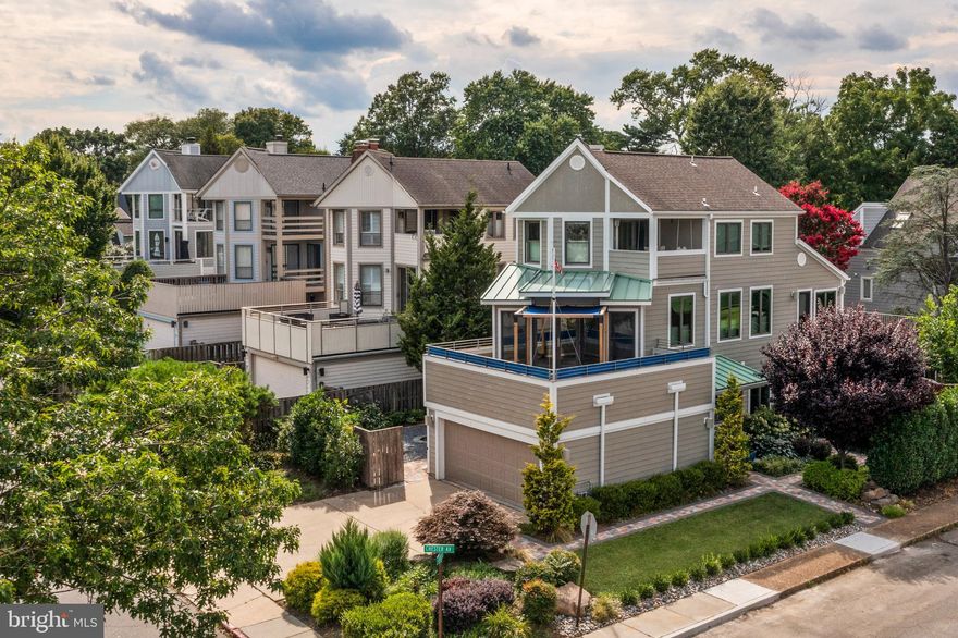 Experience Eastport living at its finest in this updated contemporary home boasting an open floor plan with hardwood floors and views of the Chesapeake Bay. This home features a two-car garage and ample driveway parking for at least two additional cars. Enjoy three decks for seamless indoor-outdoor living, along with four bedrooms and 2.5 bathrooms. The beautifully landscaped yard includes an irrigation system , vegetable garden, fire pit and is fully fenced. The primary bedroom is private and includes a spacious walk-in closet, convenient laundry facilities, steam shower, soaking tub, and private deck with views of the Bay Bridge. The main living area is designed for entertaining with an inviting, open concept, warmed by a cozy gas fireplace, built-in bookcases, and abundant natural light. Additional features include a convenient half bath and two additional decks, perfect for enjoying the views and fresh bay breezes. Great location in Eastport with walkability to restaurants, coffee, marinas, City Dock, and Historic Annapolis.