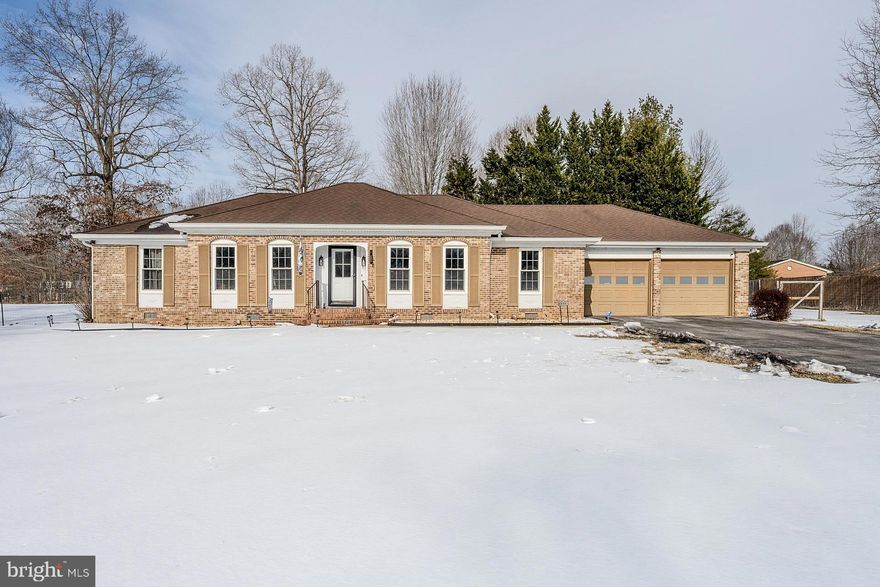 Set on a generous .77 acre corner lot, this inviting updated all brick rambler is the single-family home you have been waiting for, priced under $500,000. Conveniently located just off Charles Street Route 6, it offers easy access to shopping, dining, and commuter routes without the added cost of La Plata town taxes. Inside, you will find an open floor plan with luxury vinyl plank flooring and neutral white paint throughout, plus an abundance of windows, creating a bright and welcoming feel. The updated kitchen is a chef’s delight with gleaming quartz countertops, abundance of white cabinetry, and upgraded stainless steel appliances. A large center island provides bar seating; the adjoining dining area features a built-in serving area and the spacious living area with a brick fireplace makes entertaining and spending time with family and friends a breeze. The sunroom adds valuable extra living space and opens to a large concrete patio and lush yard, perfect for outdoor fun and relaxation.  The primary bedroom boasts a sleek contemporary lighted ceiling fan, decorative moldings, a walk-in closet, and private bath with walk-in shower. Two additional bright and cheerful bedrooms, each with contemporary lighted ceiling fans, share access to the updated hall bath, while a laundry closet with full sized washer and dryer adds convenience. A large shed and an oversized two car garage provide excellent storage and functionality, while the expanded driveway provides lots of parking space. A rare combination of space, location, and value in La Plata.