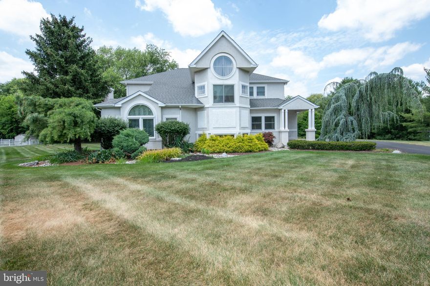 Welcome to this stunning stucco contemporary masterpiece located in the prestigious Hampton Woods, one of Ivyland's most sought-after communities. Nestled in a serene cul-de-sac on a professionally landscaped 1-acre lot, this remarkable residence offers the perfect blend of luxury and comfort, making it an entertainer’s dream both inside and out.
As you enter, you are welcomed by an elegant hallway that leads to a beautifully decorated living room and dining room combo, exuding sophistication and warmth. Step down into the inviting family room, featuring a vaulted ceiling and a magnificent marble wood-burning fireplace, which can easily be converted to gas for added convenience.
The gourmet kitchen is a chef’s delight, boasting a massive granite island, rich cherry wood cabinetry, an Italian tile backsplash, and stylish pendant lighting. Top-of-the-line appliances include a French door refrigerator, range hood, built-in microwave and oven, and a wine cellar. The adjacent breakfast room, adorned with an attractive chandelier and large windows, offers breathtaking views of the picturesque backyard. An Anderson French door leads to a beautiful deck, perfect for outdoor dining and relaxation.
This level also includes a convenient laundry room, mudroom, and access to a spacious three-car garage.
Ascend the graceful wooden staircase to the second floor, where you will find the bright and airy owner’s suite. This luxurious retreat features a walk-in closet and a spa-like master bath suite with a Jacuzzi, oversized shower, and double vanity. Three additional large bedrooms with ample closet space and a well-appointed hallway bathroom complete this floor.
The finished basement adds even more living space, featuring a game room/gym, a fifth bedroom, and a full bathroom, providing endless possibilities for recreation and guest accommodations.
Additional highlights of this exceptional home include hardwood floors throughout the first and second floors (excluding two bedrooms), Anderson windows throughout, and recent updates including a newer roof, heater, and A/C.
Ideally located minutes from major commuting routes and the rich history of Bucks County, and within the highly acclaimed Council Rock School District, this exquisite residence is ready to welcome you home. Don’t miss the opportunity to make this beautiful property your own.

Professional photos coming soon.