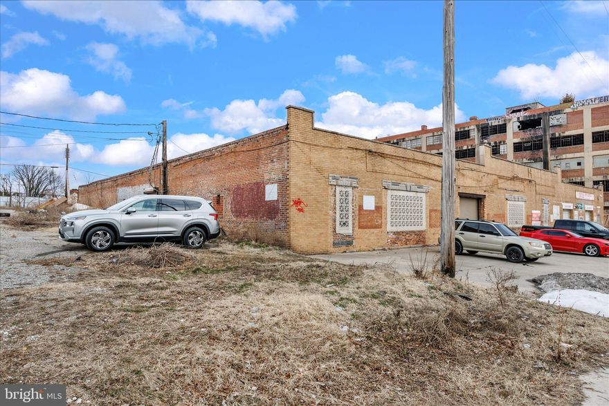 OPPORTUNITY KNOCKS.  This unit is attached to a highly successful Auto Repair Shop and adjoining the 2 units would add extra space for parking and storage.  This unit is a shell and needs a total rehab.  The value is in the space.  Could purchase both units for extra value and own the entire building!