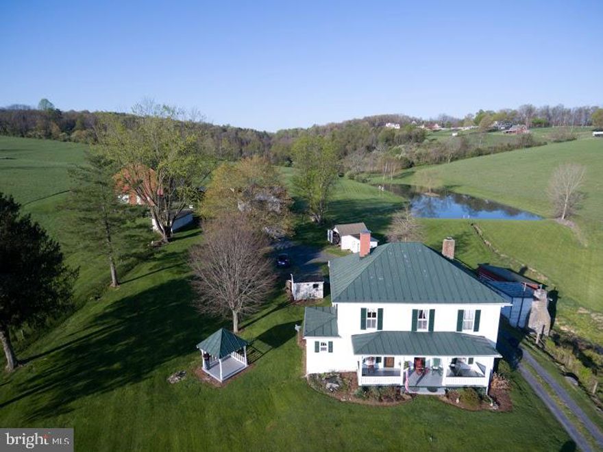 Step back in time on this 40+ acre country getaway in the heart of the Shenandoah Valley.  You'll find a classic 3 bedroom, 2 full bath farmhouse updated nicely for today's living. This circa 1800's homestead is loaded with the character and charm of yesteryear including the original stone springhouse and large pond.  Inside you will find many upgrades including refinished pine floors, an updated kitchen with quartz counters and stainless appliances, a formal dining room, family room, full bath and den. There is also a bright enclosed back porch/sunroom room with large windows and dining space . You'll love watching wildlife and  bird activity on the pond.  Upstairs you will find 3 spacious bedrooms with their original pine floors, a 2nd full bath and cozy office.  Enjoy the sunrise and mountain view from the large front porch.   The large bank barn has been featured in the Historic Barns of Shenandoah County calendar.  This is the perfect farm with a fenced pasture, barn, machine shed, outbuildings, garden space and a large   pond.  There's even an approved hilltop septic site with spectacular views.  Don't miss your chance to own a piece of property in this beautiful valley!  Just 6 miles to Bryce  Four Season Resort and an equal distance to the Shenandoah River. Convenient to Skyline Drive and the George Washington National Forest.  Only 2 hours from DC and the Metropolitan area.