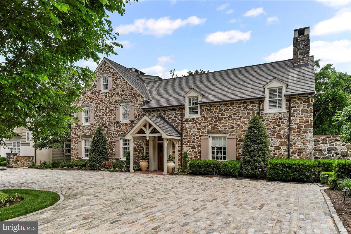 An Unbelievable Opportunity To Own A One-Of-A-Kind Estate On Finely Landscaped 8.8 Private Acres In Radnor Hunt Built In The Early 1900's. Nestled Amidst Towering Trees BLACKOAK Is A Historically Significant Estate That Embodies The Perfect Union Of Classic Elegance And Modern Design. This Is No Ordinary Home And Defines The Meaning Of True Luxury. Current Owners Have Made Many Improvements Since Their Ownership Presenting A Move In Ready Opportunity To Own A Truly Distinctive Residence With An Unmatched Lifestyle. To Further Enhance The Efficiency, Functionality And Aesthetics, The Home Is Now Equipped With Multi-Zoned Geothermal HVAC And Wired For A Whole House Generator.
This Is No Ordinary Home......Enter From Circular Belgium Block Courtyard Area. Continue On To The First Level Sunlit Piano Room With Stone Fireplace And Ship Lap Detailed Mantel. Also Featuring Crown Molding, Chair Rail, Tray Ceiling, Custom Shades And Built In Cabinetry. Not To Miss The Secluded Art Studio. Plus A Pet Grooming Area. Then Continue On To Powder Room, Coffee Bar With Marble Counter, Beverage Fridge And Microwave. Continue On To Personal Reading Space That Opens Up To Formal Dining Room With Fireplace, Tray Ceiling, Unique Chair Rail. Exterior Door To Outdoor Oasis Including Patio With Fireplace, Pizza Oven, Bar, Fire Pit , Pool And Spa All Overlooking Lushly Landscaped Grounds. Not To Miss The Nighttime Affects With All Trees Illuminated.
Entire Kitchen Was Expanded By 10' Inside And Out And Totally Renovated In 2017. All New Cabinetry, All New Appliances, Custom Stone Hood Over Range, Magnificent 10' Wooden Island With Seating , Marble Countertops, Farm Porcelain Sink, Beamed Ceiling, Sub Zero Refrigerator, Sub Zero Freezer, WOLF 6 Burner Range With Grill, Walk In Pantry And Large Window Bench Table And Chairs.
Living/Family Room Includes Custom Cabinetry, Fireplace With Custom Wooden Mantel, Beamed Ceiling, Bench Seating And Plantation Shuttered Doors To Patio And Additional Entertaining.
Upper Level Centered Around A Magnificent Primary Suite Wing With Two Baths And Two Dressing Closets. Both With Custom Builtins. This Level Also Boasts An Expansive Double Washers And Dryers. Highlighted With Large Soaking Sink And Built In Cabinetry. Additional 2nd Bedroom With Private Bath And Highlighted With Fireplace And An Abundance Of Closets. Roomy 3rd Bedroom With Recessed Lighting And Hall Bath Complete This Level . Stairway To 3rd Level Was Added By Owners Which Leads To An Additional 4th Bedroom And Private Bath. Both Levels Highlighted With Plantation Shutters Throughout.
Exterior Of The Home Provides & Embraces The Home Being Noted As A True Showplace. Highlights Include 6 Car Garage With Private Executive Office Located Above The Main Portion. Office Has Private Entrance Leading To All New Expansive Area With Maple Wood, Custom Shelving, Plantation Shutters And 1/2 Bathroom.
Private Guest Home On The Property Provides A Large 1 Bedroom & 1 Full Bath . Living And Dining Areas Along With A Fully Equipped Kitchen Highlighted With Viking Range And Sub Zero Fridge. Pine Flooring, Fireplace, Plantation Shutters And Walk In Closet Add To The Charm Of This Retreat. Outside Boasts A Private Area For Entertaining Along With A Firepit.