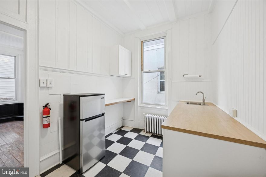 Classic Philly character meets modern opportunity in the heart of Brewerytown. Step into this freshly painted, move-in-ready building that blends vintage Philadelphia charm with flexible functionality. Located just off Girard Avenue—Brewerytown’s vibrant Main Street—this property sits among a mix of cafes, creative studios, and growing small businesses in one of the city’s most rapidly revitalizing corridors. The lease includes the 1st and 2nd floors, front half of the basement, and rear yard, offering two levels of workspace, multiple private offices, a half bath on each floor, and a 2nd-floor kitchenette. The front half of the basement provides storage or a workshop space, and the yard offers a spot for fresh air or outdoor breaks. Perfect for a low-impact tenant such as a design studio, professional office, or creative business looking to grow in place and perhaps one day own their own building. Lease price is $3,200/month NN (tenant pays building taxes, insurance, and utilities; owner covers maintenance), and the sale price is $525,000. For an investor or buyer, the property offers excellent conversion potential—you could easily separate it into two units, with a commercial space on the 1st floor and basement, and a residential unit on the 2nd and 3rd floors. The gas and electric utilities are already separated for your convenience. A rear fire escape connects the upper level to the backyard for added safety and flexibility. Conveniently located near Fairmount Park, the Philadelphia Zoo, and major routes, including I-76, this property offers both visibility and accessibility in a thriving neighborhood. Whether you’re leasing for your business or buying for long-term investment, 1217 N 29th Street offers the perfect blend of location, character, and potential.