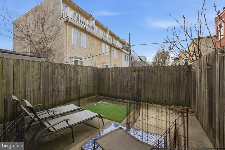 Stunning newer-construction condo (2013), one of only two units in the building, offering timeless modern finishes and exceptionally low condo fees. This bright 16-ft-wide home features beautiful 3” hardwood floors, an open first-floor layout perfect for living or dining, and a sleek kitchen with GE stainless steel appliances, white quartz countertops, dark cabinetry, and custom frosted glass uppers. The spacious first-floor primary suite is filled with natural light and includes a show-stopping walk-in California Closet, plus access to a large private rear yard ideal for entertaining. The lower level boasts 9-ft ceilings, a versatile living area, two additional generously sized bedrooms, a full bath with custom glass shower, and convenient laundry. Central air, newer mechanicals, and smart features including Ring, Nest, and Schlage system complete the home. Prime location just minutes from Center City and surrounded by top restaurants, bars, and shops—this one truly stands out.