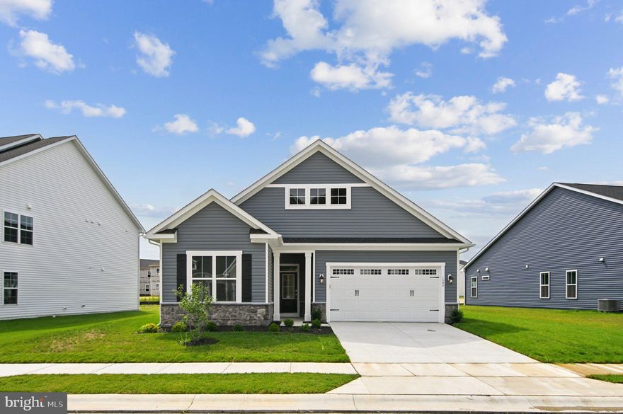 Ready for Move In, this brand new Rembrandt at Lakeside at Trappe is ideally located in a prime cul-de-sac. This home showcases a sophisticated interior with artisan trim, a main-level extension, and impressive 10-foot ceilings throughout.
The welcoming covered entry leads you to the heart of the home: a spacious family room open to a chef-inspired kitchen and a comfortable dining area. The kitchen is a highlight, featuring a substantial island, abundant white cabinets, Carrara Morro quartz countertops, a gourmet stainless steel appliance package with range hood, and a large walk-in pantry. Extend your living space to the rear screened porch, accessible from the family room and dining room. A dedicated study offers a quiet sanctuary for work or hobbies.
The primary suite offers a private retreat with dual walk-in closets and a deluxe primary en suite bathroom featuring a soaking tub. The opposite wing houses two secondary bedrooms and a full bathroom. A well-appointed laundry room with a sink, conveniently located off the two-car garage, also functions as a practical mudroom.
Located in Lakeside at Trappe, a vibrant lakeside community with a plethora of amenities and ideally located on Maryland's Eastern Shore. Lakeside at Trappe is a private retreat to live, work, and play all in one place.  Community currently offers a pool, An immersive lakeside experience is in the works, bathhouse with fitness room, ping pong, corn hole and Bark park. Playground and racquet sports courts planned to open soon with an immersive lakeside experience also in the works!
Ask about special fixed rate financing and closing costs!