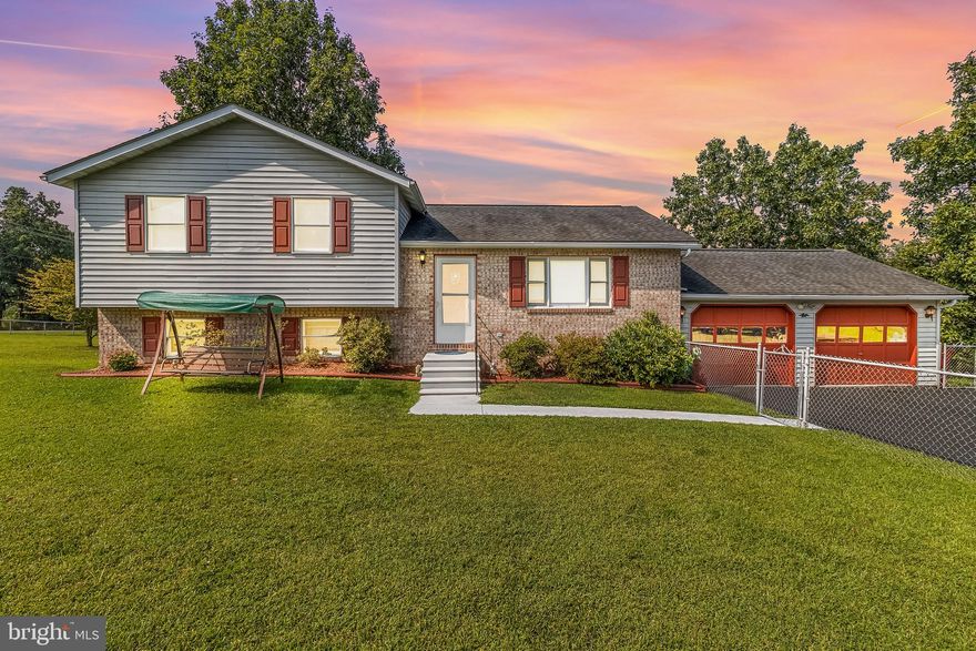 Welcome to 18 Whispering Pine Dr. This immaculate, one-owner, brick home has been lovingly maintained and is move-in ready. NO HOA OR RESTRICTIONS!! Corner lot with 1.11 acres, 4 Bedrooms | 2 Full Baths, including a lower-level bedroom & full bath. Spacious oversized 2-car garage with extra storage, plenty of parking, and fenced front & backyard! Mostly finished basement with a living area featuring a wood-burning stove. Large unfinished basement area with laundry and an abundance of storage. Beautiful flat backyard with deck, shed, and tree-lined views, that's perfect for entertaining.  Entire home re-plumbed just 4 years ago. All appliances convey, a riding lawnmower can be included with a full-priced offer (additional furniture may also convey). Convenient to Virginia & Maryland, close to warehouses, dining, and shopping. This well-cared-for home offers comfort, convenience, and charm; it won’t last long!