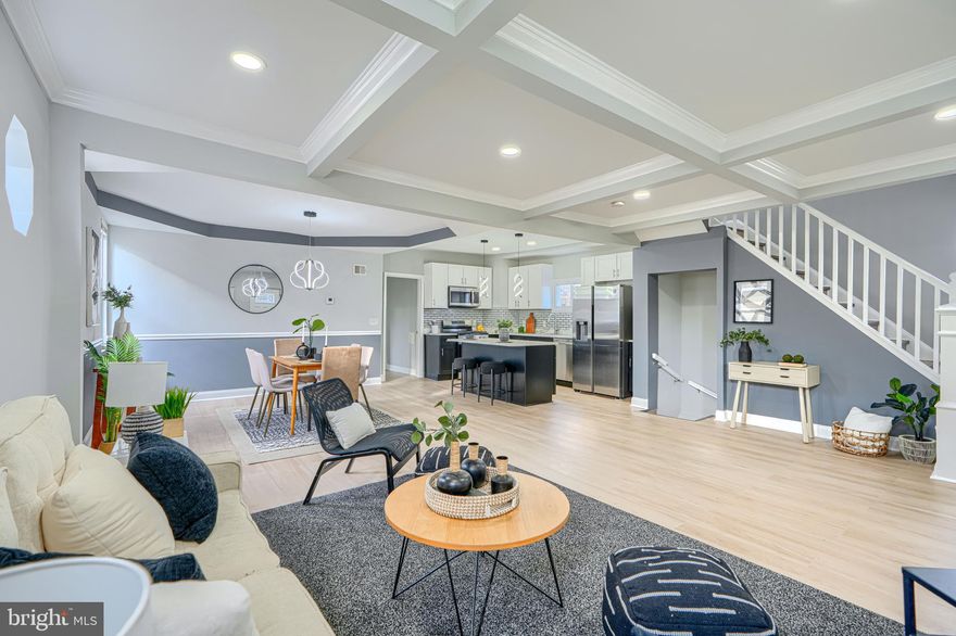 Welcome to 3802 Fernhill Ave, a beautifully updated 5-bedroom, 3-bathroom home tucked away on a quiet street. Enter inside to an inviting open-concept layout highlighted by stylish exposed ceiling beams that add warmth and character. The spacious dining room flows seamlessly into the kitchen—truly the heart of the home—featuring a large island with additional seating, stainless steel appliances, a stunning backsplash, and modern lighting. The main-level primary bedroom offers added convenience and includes an adjacent bonus room—perfect for a home office or nursery—along with a full bathroom, providing flexible living options. Upstairs, you’ll find three generously sized bedrooms and a well-appointed full bathroom. The fully finished basement expands your living space even further, complete with a large recreation room, an additional bedroom, a full bathroom, and a dedicated laundry area with washer and dryer. Enjoy outdoor living in the spacious backyard, ideal for entertaining, along with a large deck and a welcoming covered front porch.