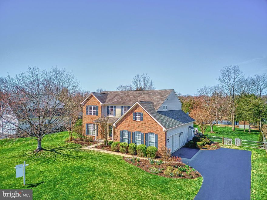 Absolutely Immaculate!  Gorgeous Brick Front w/Porch in coveted Oak Valley.  Huge Level Fenced Yard Backs to 15 acre stocked LAKE.  Hardwood Floors on main level and plush carpeting ..Dynamite Remodeled Mud Room & 2 car side Garage. Several upgraded lighting fixtures.   Large Family Room include wall of windows and beautiful Built-ins cabinets.  The Gourmet Kitchen has new gorgeous white quartz counter tops, freshly painted white cabinets, Stainless Steel appliances plus a large center island.   Philips Hue Hub allows kitchen under cabinet lighting. The Sunroom allows extra square footage and walks out to the oversized trex deck and the private yard.  Enjoy the awesome Primary  Suite which features a Walk in closet, vaulted ceiling and plenty of space for all your dressers.  The Primary Bathroom  include a  Jetted Tub, large shower and two sink vanity.   Huge walk in closet with custom built ins. Three Large Bedrooms and a full bath make this floor complete!  Fully Finished Rec Room  the third Full Bath, plus an extra large  Storage area.  Walkout Stairs to rear yard which is fenced with split rail and backs to the lake; enjoy the peaceful view....Designer Paint,  professionally landscaped.  Rachio Smart Lawn Sprinklers, Nest thermostats, carbon monoxide sensors and Ring home security.   OPEN HOUSE THURSDAY Evening,  APRIL 7TH FROM 5-7:00 pm.