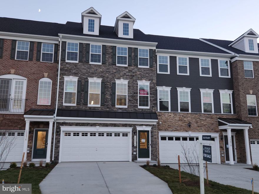 FINAL HOME! IMMEDIATE MOVE-IN! Welcome to this luxurious interior townhome in the coveted Marlboro Ridge community. Set against a backdrop of tranquil trees, this home offers a retreat from the outside world. With three bedrooms, two full baths, and three half baths, it provides ample space for modern living. Ascend to the loft, where a rooftop terrace awaits, offering panoramic views and a perfect outdoor escape. Oak stairs throughout the home add a touch of sophistication. The gourmet kitchen is a culinary delight, designed for both style and functionality. Adjacent to the living room, a pocket office offers a dedicated workspace. The finished lower level, with a walkout to the fully fenced rear yard, extends your living space, and allows you to create a private outdoor haven for relaxation and entertainment. This home seamlessly combines elegance and practicality, making it a perfect choice for those seeking the Marlboro Ridge lifestyle. The neighborhood offers a rich amenity program with a club house, pool, tennis courts, tot lots, equestrian center, equestrian and walking trails. Photos shown are from a similar home. Contact us to schedule a tour or visit our model home today!