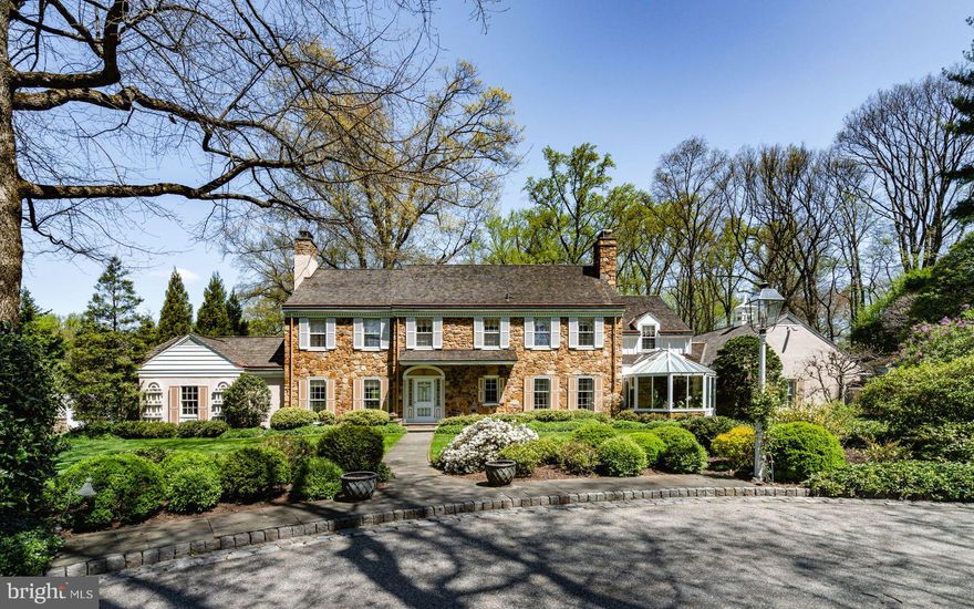 Offered for the first time, we are thrilled to present the “Hothorpe Assemblage”—an exceptional estate situated on a stunning 3-acre property tucked down a private lane in the very popular Ardrossan neighborhood. The two separately deeded parcels were purchased in 1960. The owners engaged noted Main Line architect Walter Durham, who designed one of his finest classic center hall colonials. Over the past 30 years, the owners have created three separate additions.
 
The front entry opens to a center hall, flowing beautifully to the living room, library, dining room, and study, all with wood-burning fireplaces. Cooking and entertaining is a delight in the spacious, gourmet, eat-in kitchen, equipped with Sub-Zero, Dacor, and Thermador appliances and custom cabinetry. Adjoining is a spectacular oversized Florida room with very high ceilings, a wet bar, and lots of space for large or small gatherings. Multiple sliding glass doors open to beautiful brick and flagstone terraces and a pool.
 
On the second floor, a generous primary bedroom suite offers ample closets and a well-appointed bathroom. There are four additional bedrooms and three bathrooms. A large walk-up attic provides storage. The lower level is partially finished with a powder room and space for media, games, and a gym.
Nothing was spared on the outstanding features throughout, including detailed millwork and moldings, custom lighting, hardwood flooring, four fireplaces, abundant closets, and thoughtfully designed built-in storage spaces. The home features a newer cedar shake roof and updated mechanical and electrical systems. The mudroom, drop zone, laundry, and powder room exit to a 2-car attached garage and additional carport.
 
Mature, meticulously maintained landscaping with expansive woodland paths are a showstopper. All in all, this is an exciting opportunity to own a magnificent property in a premium country location, just minutes from the very best restaurants and shopping in Wayne, top-rated schools, and an easy commute to Center City and Manhattan. See agent notes regarding two additional parcels.
