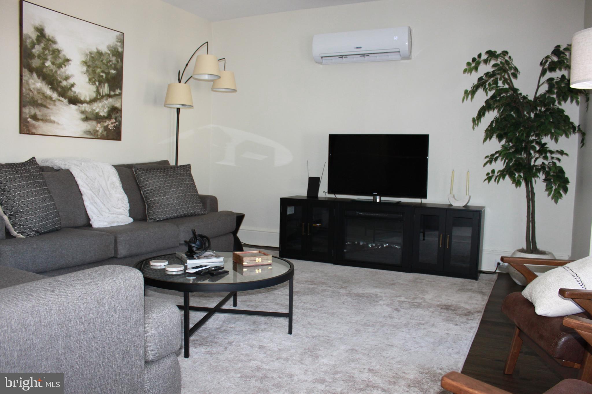 This incredible downtown 3rd floor apartment with many updates offers 2 bedrooms and 1 bath. This apartment has been remodeled and features high ceilings, beautiful laminate floor throughout, updated kitchen, spacious living room and dining room. and washer/dryer in unit. Mini Split units provide heat and air conditioning. Rent INCLUDES sewer, water and trash. NO smoking . Pets will be considered on case by case basis. Option to rent this apartment furnished is available. Square footage is estimated. Apartment also has access to 2 porch areas.