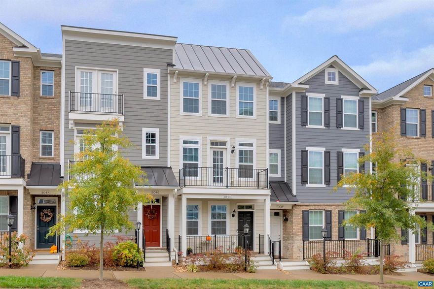 Yes, new price and a fantastic value. Sweet, new to you town home in Old Trail with a garage, deck on the front and back of the house and in a great central location. This home is highly energy efficient and has been Pearl Certified Gold. The delightful, deluxe kitchen has granite counters, chimney hood, stainless steel appliances and open to the main level. Two primary bedrooms on the top level with upgraded tile, frameless shower door and double vanity, and the laundry room too.  The lowest level has a nice sized Rec Room with a full bathroom that can easily be used as an office or guest room too.  Enjoy all that Crozet has to offer, including the beautiful mountain views.,Granite Counter,Wood Cabinets