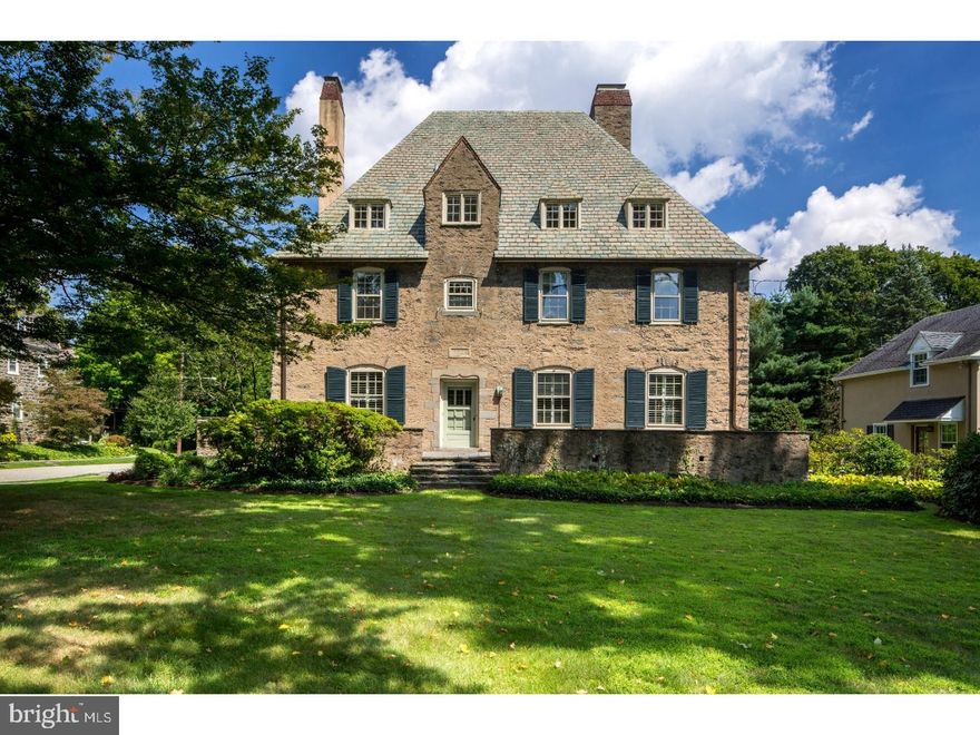 Immaculately maintained 6 bedroom, 3.5 bath Normandy-style stone Colonial in the heart of Chestnut Hill. The beautiful original details of this home such as deep windowsills, original fireplaces and high ceilings have been lovingly updated and combined with more modern features such as an updated kitchen with custom cabinetry and large pantry, new baths, refinished hardwood floors, tankless hot water heater and new central air (2016). The formal dining room has French doors that open to the sunroom with rear yard access. The large, formal living room with fireplace offers beautiful windows with deep sills and a cozy sitting room across the hall, also with fireplace and built-in shelving. A large powder room off the hall offers additional storage and shelving. The first floor offers a convenient family entrance off of the garage that opens to the sunlit kitchen with breakfast room, pantry with additional storage and laundry room. Upstairs, a spacious family room with vaulted ceiling is accessed by the rear stairs and provides a private spot for entertaining family or friends. The huge master bedroom offers a private deck, 2 walk-in closets and new full bath with stall shower and tub. An additional bedroom on the second floor offers a new full bath and large sitting room with fireplace. A convenient and sunny office completes the second floor. The third floor offers 4 additional bedrooms, full hall bath with clawfoot tub, cedar closet and ample storage possibilities. The spacious rear yard has a slate terrace for entertaining and mature, specimen plantings. Located in a walk-to-everything location near Chestnut Hill restaurants and shops, Fairmount Park, the train to Center City and a just a short drive to major highways.