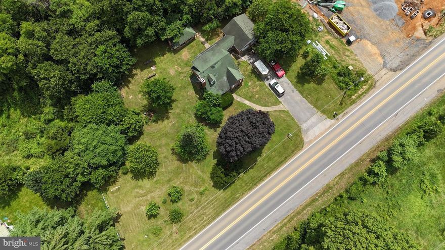 Excellent prime location.  Heavily travelled intersection,  overlooks Route 9,   Exit  16  I-81.
Great visibility, can be seen from Interstate 81 and Edwin Miller Boulevard.  
Newly constructed service station on East side of  property.  Many possibilities for lot,
Solid-built brick home on property with large attached garage,  fireplace and gazebo in rear.
Residence currently 2 bedrooms, one bath, fireplace in living room, dining room and kitchen 
on first floor with fully expandable attic,