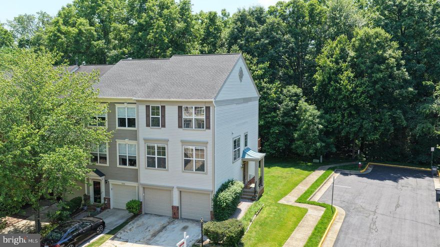 This Miller & Smith end-unit townhome in Broadlands offers 1,960 square feet of above-grade finished living space across three levels, with an oversized 440 sq ft 2-car garage, and two Trex decks backing to a wooded tree buffer. The original owner made several thoughtful modifications when purchasing from the builder that set this home apart from others in the same model.

**Main Level**
The stairwell wall was lowered to four feet, opening the main living room level to natural light and creating easy sightlines from the living and dining areas through to the kitchen and down to the entry below. A large architectural opening in the kitchen wall connects visually to the entry window, drawing light throughout the level. The builder's dividing wall between the living and dining areas was removed, creating a more open, functional layout. New, upgraded carpeting in the Living/Dining room area. The kitchen peninsula was also eliminated — a change neighbors with the same model consistently note was a smart decision — resulting in a kitchen that is easy to work in and move through. The kitchen features beautiful hardwood floors, granite countertops, and a full suite of 2018 LG stainless steel appliances: 5-burner gas range, refrigerator with icemaker, and dishwasher. New 2" plantation blinds on all three living and dining room windows. Sliding glass doors lead to the upper Trex deck overlooking the tree buffer. A powder room completes this level.

**Upper Level**
The primary suite features vaulted ceilings, two skylights, a walk-in closet, a double closet, and an en-suite bath with double sinks and a tub/shower combination. Two additional bedrooms and a second full bath with tub/shower complete the bedroom level. Upper-level laundry with 2018 LG washer and dryer. 

New upgraded wall-to-wall carpet in the living and dining rooms, main staircase, upper hallway, and all three bedrooms. Fresh off-white paint throughout the entire property.

**Lower Level**
Enter through the hardwood foyer and staircase — three wide, gracious hardwood steps lead down to the recreation room, and beautiful hardwood stairs rise to the main level above. The recreation room features a gas fireplace, imported Italian clay tile flooring, a ceiling fan, a built-in decorator shelf, an L-shaped walk-in closet, sliding glass doors to the lower Trex deck, and a large window. A powder room and utility room with HVAC and hot water heater complete this level.

**2018 Replacements**
Roof, HVAC, gas hot water heater, Trex decks, LG washer and dryer, LG dishwasher, LG 5-burner gas range, and LG refrigerator with icemaker.

**The Community**
Broadlands offers pools, tennis and basketball courts, miles of walking and biking trails, tot lots, a nature center, community centers, and a fitness center — all for $134/month. The Summerbrooke pool and playground are four blocks away. A HOA-installed picnic area with three tables and bench seating sits just behind in the tree buffer. Hillside Elementary, Eagle Ridge Middle, and Briar Woods High School. Minutes to the Ashburn Silver Line Metro, Dulles International Airport, Harris Teeter, and Broadlands Village Center.

Professional photos will be uploaded Tuesday, 5/19