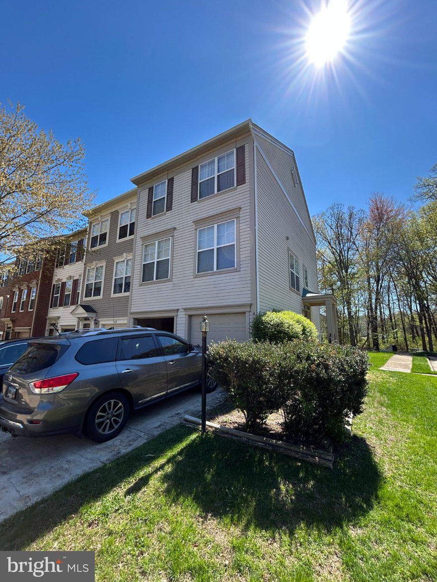 This Miller & Smith end-unit townhome in Broadlands offers 1,960 square feet of above-grade finished living space across three levels, with an oversized 440 sq ft 2-car garage, and two Trex decks backing to a wooded tree buffer. The original owner made several thoughtful modifications when purchasing from the builder that set this home apart from others in the same model.

**Main Level**
The stairwell wall was lowered to four feet, opening the main living room level to natural light and creating easy sightlines from the living and dining areas through to the kitchen and down to the entry below. A large architectural opening in the kitchen wall connects visually to the entry window, drawing light throughout the level. The builder's dividing wall between the living and dining areas was removed, creating a more open, functional layout. New, upgraded carpeting in the Living/Dining room area. The kitchen peninsula was also eliminated — a change neighbors with the same model consistently note was a smart decision — resulting in a kitchen that is easy to work in and move through. The kitchen features beautiful hardwood floors, granite countertops, and a full suite of 2018 LG stainless steel appliances: 5-burner gas range, refrigerator with icemaker, and dishwasher. New 2" plantation blinds on all three living and dining room windows. Sliding glass doors lead to the upper Trex deck overlooking the tree buffer. A powder room completes this level.

**Upper Level**
The primary suite features vaulted ceilings, two skylights, a walk-in closet, a double closet, and an en-suite bath with double sinks and a tub/shower combination. Two additional bedrooms and a second full bath with tub/shower complete the bedroom level. Upper-level laundry with 2018 LG washer and dryer. 

New upgraded wall-to-wall carpet in the living and dining rooms, main staircase, upper hallway, and all three bedrooms. Fresh off-white paint throughout the entire property.

**Lower Level**
Enter through the hardwood foyer and staircase — three wide, gracious hardwood steps lead down to the recreation room, and beautiful hardwood stairs rise to the main level above. The recreation room features a gas fireplace, imported Italian clay tile flooring, a ceiling fan, a built-in decorator shelf, an L-shaped walk-in closet, sliding glass doors to the lower Trex deck, and a large window. A powder room and utility room with HVAC and hot water heater complete this level.

**2018 Replacements**
Roof, HVAC, gas hot water heater, Trex decks, LG washer and dryer, LG dishwasher, LG 5-burner gas range, and LG refrigerator with icemaker.

**The Community**
Broadlands offers pools, tennis and basketball courts, miles of walking and biking trails, tot lots, a nature center, community centers, and a fitness center — all for $134/month. The Summerbrooke pool and playground are four blocks away. A HOA-installed picnic area with three tables and bench seating sits just behind in the tree buffer. Hillside Elementary, Eagle Ridge Middle, and Briar Woods High School. Minutes to the Ashburn Silver Line Metro, Dulles International Airport, Harris Teeter, and Broadlands Village Center.

Professional photos will be uploaded Tuesday, 5/19