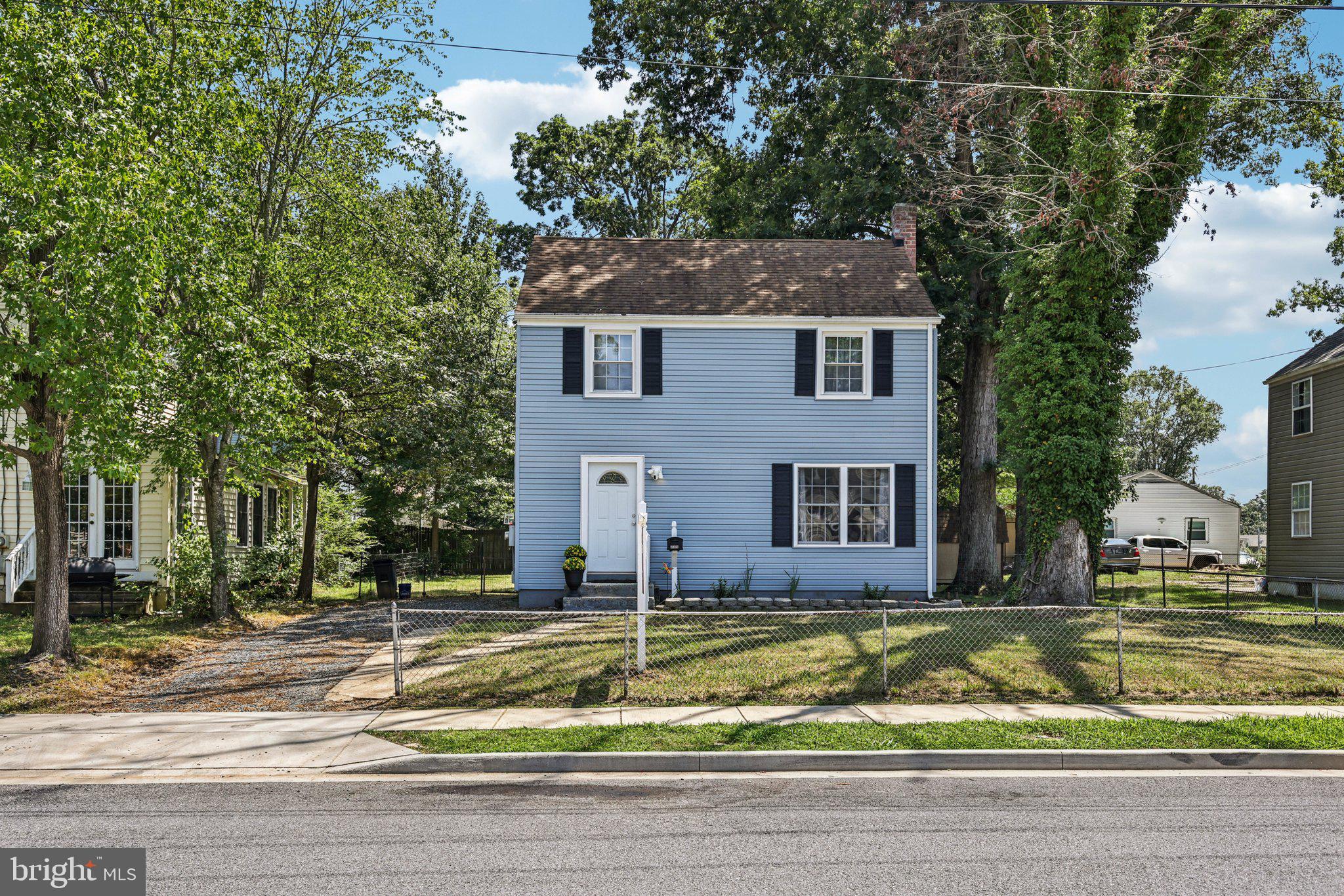 Professional photos should be uploaded shortly- please check back!! ** Full of VINTAGE CHARM and modern UPDATES, this very AFFORDABLE 3-bedroom single-family home offers character, convenience, and a big yard—all at a price lower than most townhomes! ** Step inside to discover a BEAUTIFULLY RENOVATED KITCHEN, featuring white shaker cabinets, marble-look countertops, stainless steel appliances, and updated lighting. ** Vintage solid hardwood flooring flows through the SPACIOUS living room and dining area, where new SLIDING GLASS DOORS bring in sunlight and lead to a backyard DECK, perfect for outdoor enjoyment. The LARGE, LEVEL BACKYARD is fully FENCED and includes a shed, offering a secure and practical space for pets, play, or gardening. Upstairs, three cozy bedrooms share an UPDATED FULL BATHROOM. ** The unfinished basement provides generous storage, laundry area, and includes a perimeter drain system, sump pump, and ROUGH-IN FOR AN ADDITIONAL BATHROOM—offering excellent potential for future living space and equity. ** Also, most windows have been replaced with energy-efficient vinyl, helping keep utility costs down. ** With a long driveway for ample off-street parking and a FANTASTIC LOCATION just minutes from NAS PAX River, shopping, and dining, this home is a smart and charming choice. Schedule your tour today! *Select images have been virtually staged. Furnishings depicted are digital renderings and do not represent physical items in the home.