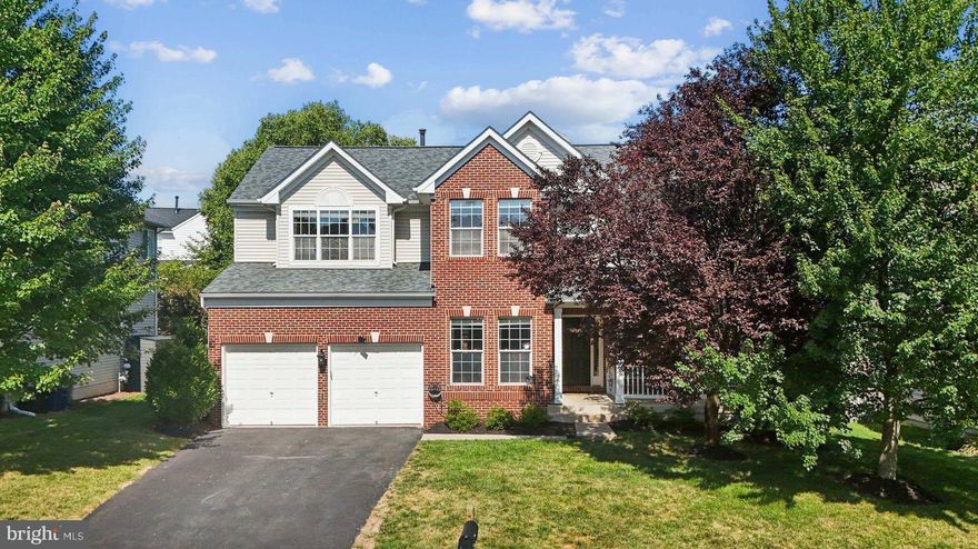 This Princeton II model, a classic center hall oversized colonial, boasts all-level bump-out extensions. The family room, complete with a fireplace, adjoins the kitchen, which features a granite island, breakfast bar, built-in desk, walk-in pantry, and ample space for a table. The second floor houses five generous bedrooms, four of which have walk-in closets. The primary bedroom includes an extended walk-in closet with a built-in storage system, as well as an ensuite with a jetted tub and separate shower. The fully fenced yard offers a stamped concrete patio and a play area perfect for cornhole or horseshoe family tournaments. The lower level provides abundant storage, including a large recreation room, bonus room, and full bath. The community amenities include tot lots, tennis courts, a basketball court, common areas, and a Pool. The location is ideal, being just minutes from downtown Leesburg with quick access to the Dulles Greenway, Routes 15 and 267.