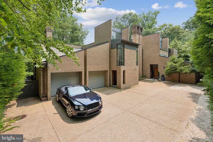 This significant Mid-Century home, designed by Charles Goodman, is a rare McLean treasure. Its exceptional Gold Coast location is further elevated by a private, parklike setting. A major 2012 renovation by Added Dimensions seamlessly integrated modern conveniences while preserving the home’s original contemporary character and timeless finishes. Spanning 5,461 square feet, the residence offers 5 bedrooms and 4.5 bathrooms. The gorgeous grounds border a national park, providing ultimate privacy and serene garden views. An open-concept layout features polished concrete and hardwood floors, creating a smooth flow throughout. An attached garage offers convenient parking, complemented by an expansive motor court for additional vehicles. This prime location delivers both tranquility and accessibility, with easy access to DC, Tysons, and the airports. Experience the ideal blend of style, space, and natural beauty in this one-of-a-kind property.