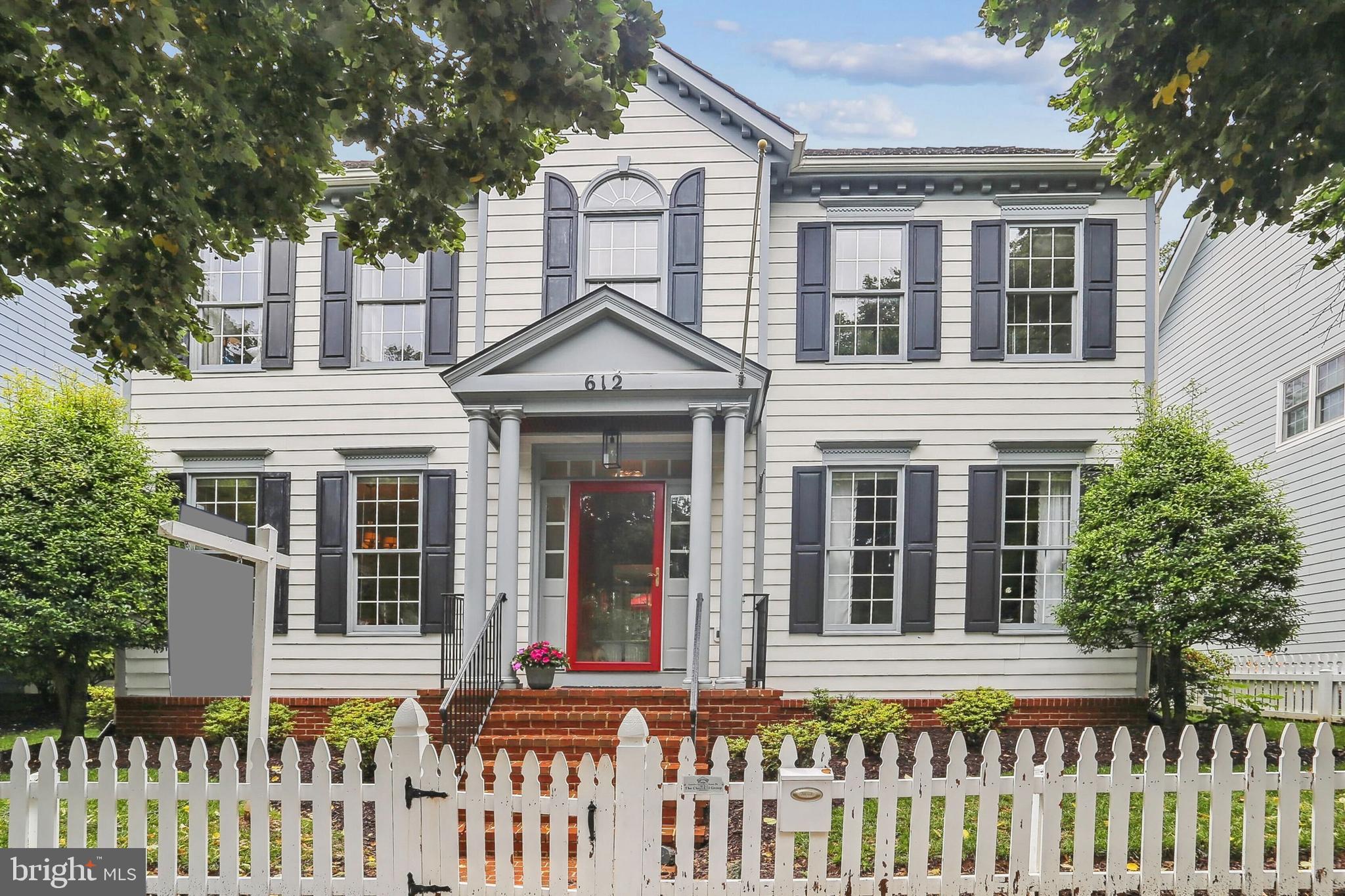 Stately single-family home with a lovely backyard and an unbeatable location in the Kentlands! The welcoming foyer opens to a spacious formal living room with hardwood floors and a large dining room with decorator lighting. The kitchen is a chef’s dream, featuring stainless steel appliances, a large center island, granite countertops, and white cabinetry, and it opens to a sunny breakfast area with a bay window. The family room is filled with natural light and offers a wood burning fireplace and new French doors leading to an expansive deck with a picturesque trellis, overlooking the big backyard. A beautifully remodeled powder room completes the main level. Upstairs, the light-filled primary suite features hardwood floors, two walk-in closets, and a luxurious en-suite full bath. The second bedroom is bright and spacious with hardwood floors and a double-door closet. The third bedroom is large and includes a double window, lighted ceiling fan, and hardwood flooring, while the fourth bedroom offers generous space, two closets, and hardwood floors. The finished lower level includes a game room, a media room, and a storage area with a full bath rough-in. The backyard is a serene retreat with a lovely terraced area and a wooded area, leading to a two-car garage and driveway. Major updates include the HVAC system and furnace (2021) and the roof (2018). Ideally located near Rachel Carson Elementary and all the shopping, dining, and entertainment the Kentlands has to offer—this home has it all!
