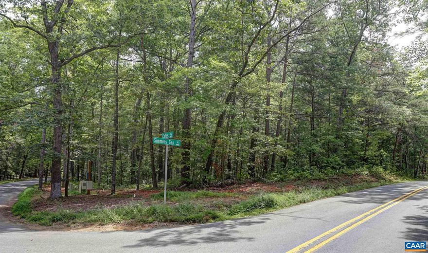 CORNER OF SIMMONS GAP ROAD AND ESTES RIDGE ROAD -  Ten acres of mature woods stategically located on the corner of Simmons Gap and the country lane of Estes Ridge. Property which has long road frontage consists of two parcels being combined and sold as one. No Home Owners Association! Design and build  your dream residence on this very well priced parcel. Located between Free Union and Earlysville, but so convenient to Charlottesville, University of Virginia. Airport, UVA's North Fork Research Park and National Ground Intelligence Center.