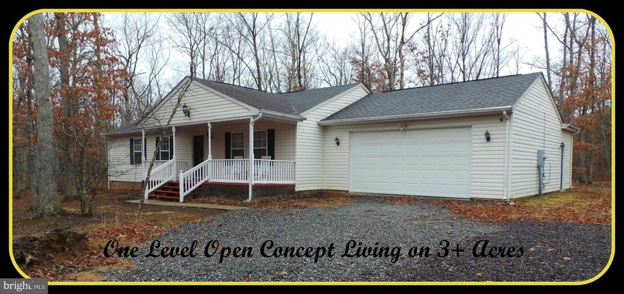 Charming Ranch with One level open concept living on 3+ Acres!   3/2 with a 3 car over-sized garage  on a peaceful wooded flat lot .   Master suite has a beautiful walk in closet with built-ins.  Watch the wildlife off your front porch or on the large back deck.