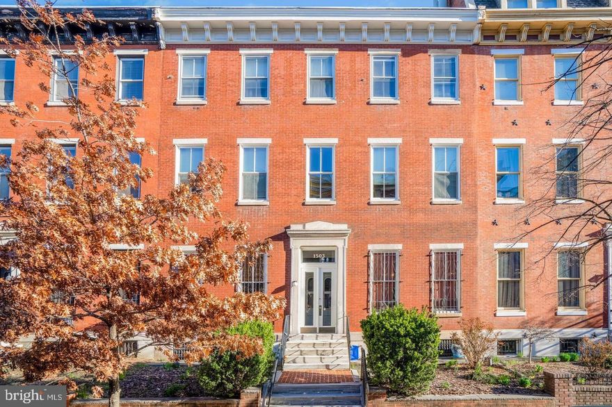 A boutique condo on one of the most sought after streets in Fairmount! This ornate building consists of 7 units and truly embodies historic Philadelphia charm. Enter through the shared vestibule and admire the original hardwood marquetry and statement staircase that ascends to your unit. The open concept floor plan is sun-soaked and accented by a wood-burning fireplace, pine flooring, a galley kitchen, and a spiral staircase to your private roof deck with unobstructed city views.  The thoughtfully laid out kitchen offers a space to prep a meal for one, two, or mutliple guests and features white laminate cabinets, a full appliance package, and new ceramic tile. The en-suite, full bathroom in the hallway offers you the option for privacy. An in-unit, stacked washer and dryer is adjacent to the bedroom.  The bright bedroom is spacious and complete with ample closet space and a juliet balcony! Assigned storage in the building basement. Central AC. Low HOA fee. Easy street parking. Community garden nearby! Conveniently located steps from the Broad Street Line, Giant, Osteria, South, Starbucks, Aldi, Bar Hygge, and more.
Some photos may be virtually staged.