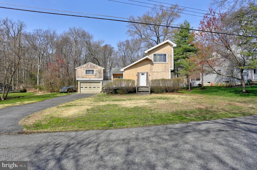 Opportunity awaits in the desirable Loch Haven community! This 3-bedroom, 2 bath home sits on a spacious .52 acre lot and offers endless potential for the right buyer. The property also features a detached garage with an apartment or bonus space above, complete with 1 bedroom, a full bathroom, and space for a small kitchen and living area - ideal for guests, rental income, or a home office. Apartment square footage is not included in the total living space. 
Bring your vision and transform this home into exactly what you have been dreaming of. Home is being sold as-is. With access to a community beach, pier, playgrounds, trails, and year-round events, the location adds even more value.