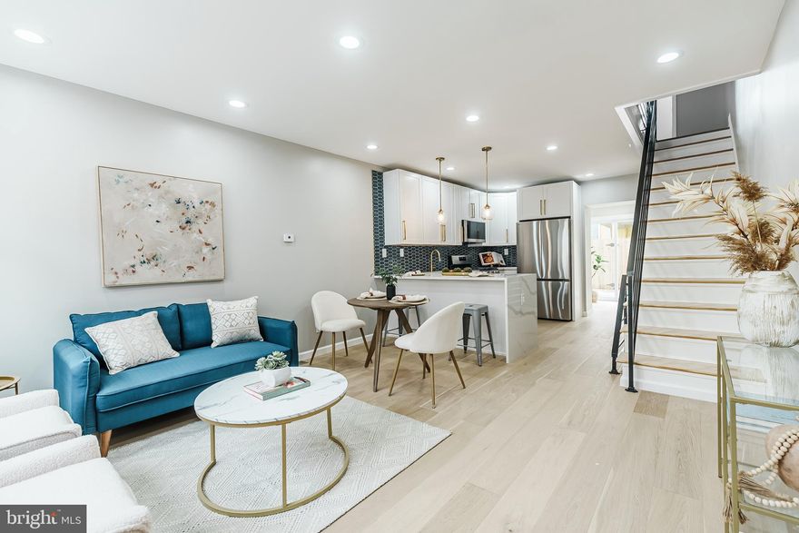 Welcome to 112 Hoffman St, a stunning, fully renovated home in the heart of Pennsport.  From the moment you step inside, you’ll be impressed by the bright and spacious living area featuring high ceilings, wide-plank hardwood floors, and an open floor plan perfect for modern living.  The gourmet kitchen will be the hub of your home, offering quartz countertops with a waterfall island, a stylish tiled backsplash, upgraded stainless steel appliances including a counter-depth refrigerator, and ample cabinetry with a pantry for extra storage. The main level also includes a convenient powder room and laundry area.  Step outside to your private backyard oasis, ideal for relaxing, entertaining, or summer BBQs.  Upstairs, you’ll find two spacious bedrooms with generous closet space and a beautifully updated hall bath featuring a tiled accent wall and extra-deep soaking tub.  The finished basement provides additional living space, perfect for a media room, home office, gym, or guest suite, and includes a modern full bath.  Located just steps from neighborhood favorites like Wolf Burger, Moonshine, and Gooey Looie’s, and offering easy access to I-76 and I-95.  This home combines comfort, convenience, and style in one of South Philly’s most desirable neighborhoods.  Schedule your private showing today and experience everything 112 Hoffman Street has to offer!