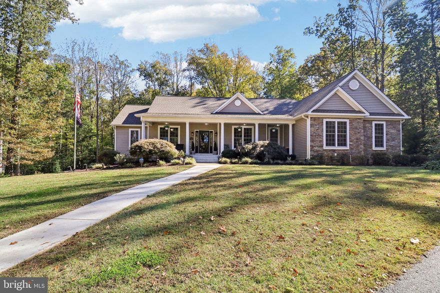 If luxury is what you’re looking for, this stunning custom-built ranch home delivers that and so much more! Set on 5 private acres, this property offers the perfect blend of sophistication, comfort, and functionality—all within minutes of I-95, VRE, commuter lots, and shopping.

Inside, recent updates include fresh Benjamin Moore “Swiss Coffee” paint in the living room, sunroom, office, 2nd bedroom, basement family room, and 4th bedroom. The home features 5 bedrooms, with 4 boasting walk-in closets, and smart home technology with a router, server, and Nest thermostats on both levels for dual-zone comfort.

The gourmet kitchen is a chef’s dream—complete with stainless steel appliances, granite countertops, 42” cabinetry, vaulted ceiling, recessed lighting, ceramic flooring, breakfast bar, and a massive walk-in pantry. Just off the kitchen, the sunroom shines with a tray ceiling with lighting, French doors, and custom entryway molding, filling the space with natural light.

The family room features a gas fireplace with marble surround, vaulted ceiling, hardwood floors, and recessed lighting, offering a cozy and inviting atmosphere. On the main level, the primary suite impresses with a tray ceiling, recessed lighting, dual walk-in closets, and a spa-style bath featuring heated tile floors, walk-in shower with dual shower heads and controls, and dual vanities. A second primary bedroom on the main level offers its own full bath with custom ceramic shower and a spacious walk-in closet.

The walkout basement provides even more living space, including a large recreation room with a wet bar, built-in kegerator, and refrigerator, plus two bedrooms with private full baths, a media room, exercise room, safe room, and ample storage.

Enjoy surround sound in most rooms, a security system with no fees, and a whole-house well water filtration system with a water softener for added comfort and peace of mind.

Outdoors, the home continues to impress with a maintenance-free deck with gazebo, covered concrete patio, full front porch, and a fenced backyard with five gates providing access to trails and the property. Additional features include Leaf Guard gutters, sprinkler system, storage buildings, a heated dog kennel with electric, and an oversized 3-car garage with utility sink, attic access, and pull-down stairs.

This exquisite home truly has it all—luxury, privacy, and modern convenience—offering a lifestyle as impressive as the home itself.