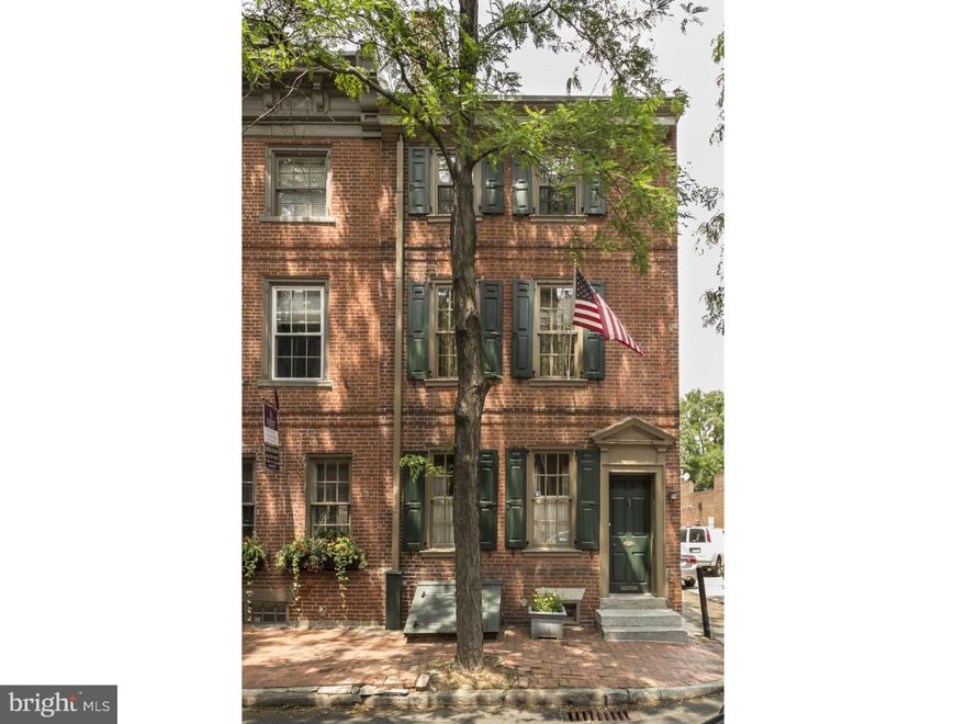 Rare and Lovely Society Hill Estate located on the most desirable block of Delancey Street! This exquisitely maintained townhouse is listed on the Philadelphia Register of Historic Places, and offers an expansive first floor plan that features a handsome living room with fireplace, sizable dining room, and Cook's kitchen featuring a Thermador Professional Range and hood,  and Bosch Dishwasher. A charming breakfast area opens out to a lushly planted garden with Koi pond and fountain and patio that provides direct access to private gated parking, entering out onto Cypress Street! On the upper floors enjoy 3 bedrooms, and 2 beautifully updated bathrooms. Walk through a handsome library with custom built-in shelving, to an inviting family room ideal for binge watching your favorite shows. The dormer attic is beautifully appointed with custom built-in furnishings. The location can't be beat! Walk to nearby grocers, gourmet restaurants, Ritz Movie Theatre, Historic landmarks and prized private schools.