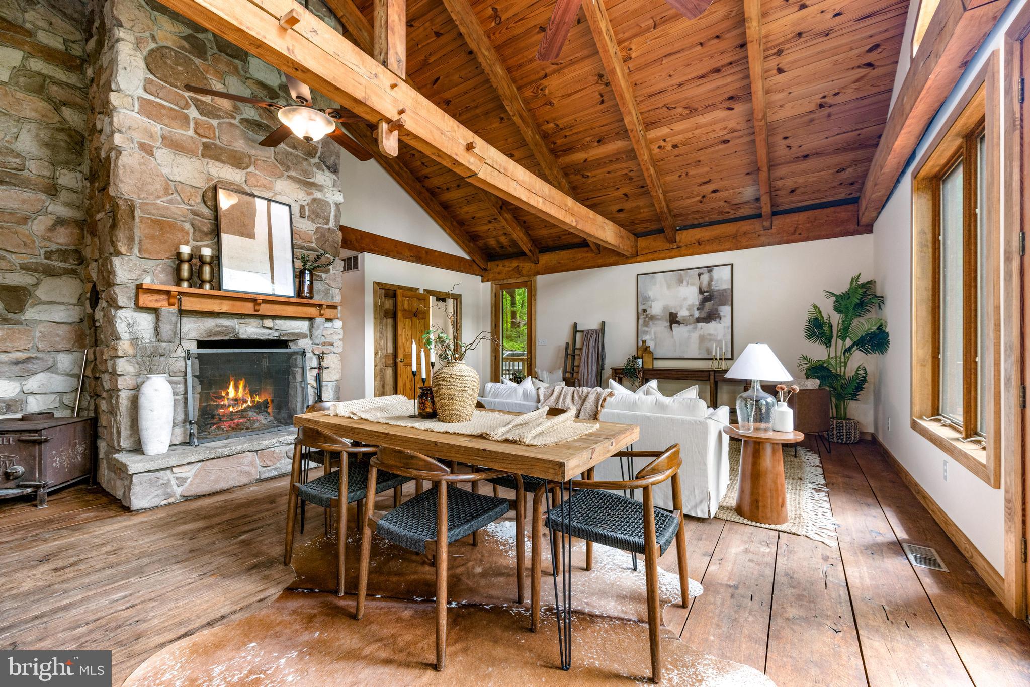 **OFFER DEADLINE FOR SATURDAY JUNE 7TH AT 11:59 PM** Welcome to your dream cabin-style home nestled away in York County just minutes from the Maryland line! This stunning property has undergone a complete remodel where ideal modern renovations flatter the historic cabin character throughout. You'll notice brand new bathrooms, with a spa style master ensuite and walk in closet, a large entertainer friendly kitchen with quartz counters, custom trim throughout and a renovated lower level with new luxury vinyl plank flooring. The charm hits hard, featuring barn style vaulted ceilings, restored barn wood flooring on the main level that's heated planks throughout the living/kitchen and master, a large stone fireplace centering the main room, floor to ceiling windows and stunning views off the brand new elevated wrap around deck. Fully serviced and custom rebuilt in 2025, the boiler and A/C ensure year-round comfort, while radiant floor heating adds the perfect touch of luxury. This is a once in a lifetime custom renovation that cannot be duplicated elsewhere and will not last long! Make sure to schedule your tour today!