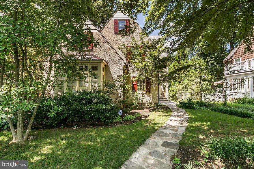 New price & best value for this warm 4 BR, 3 BA home. A welcoming stone walkway & gardens lead to a gracious entry.  Feat: Hardwoods throughout, lovely indoor & outdoor living, formal LR w/ FP leading to a bright, versatile sunroom, spacious BRs & large MBR w/updated ensuite BA, Fabulous suite style 3rd lvl. perfect as a family rm w/bonus room. Landscaped,stone patio  & fenced yd. 2-car garage.