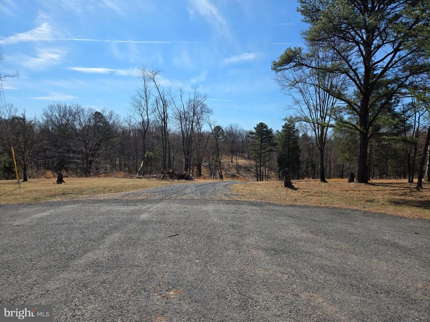 Rare Opportunity -- Perfect 5-Acre Building Lot in a Quiet, Gated Community

Located in the highly desirable community of The Meadows at Sleepy Creek, this 5-acre lot offers the perfect spot to build your custom home. The property is set among gently rolling hills and surrounded by mature hardwood trees, giving you plenty of privacy and a peaceful setting where you can enjoy all nature has to offer.

Situated on a quiet cul-de-sac, the lot has been partially cleared and includes a construction-ready aggregate driveway base. The community features beautiful homes, well-maintained, paved roads, and abundant wildlife visiting from the adjacent 23,000-acre Sleepy Creek Wildlife Management Area, a state-maintained nature preserve renowned for its year-round outdoor recreation, 200-acre lake, and miles of hiking trails.  

From among nature's quiet seclusion you are still just a pleasant drive from Martinsburg, Hagerstown, Winchester, and several other vibrant communities. If you are looking for a place to relax, unwind, and build the home of your dreams, this is an opportunity you will not want to miss.