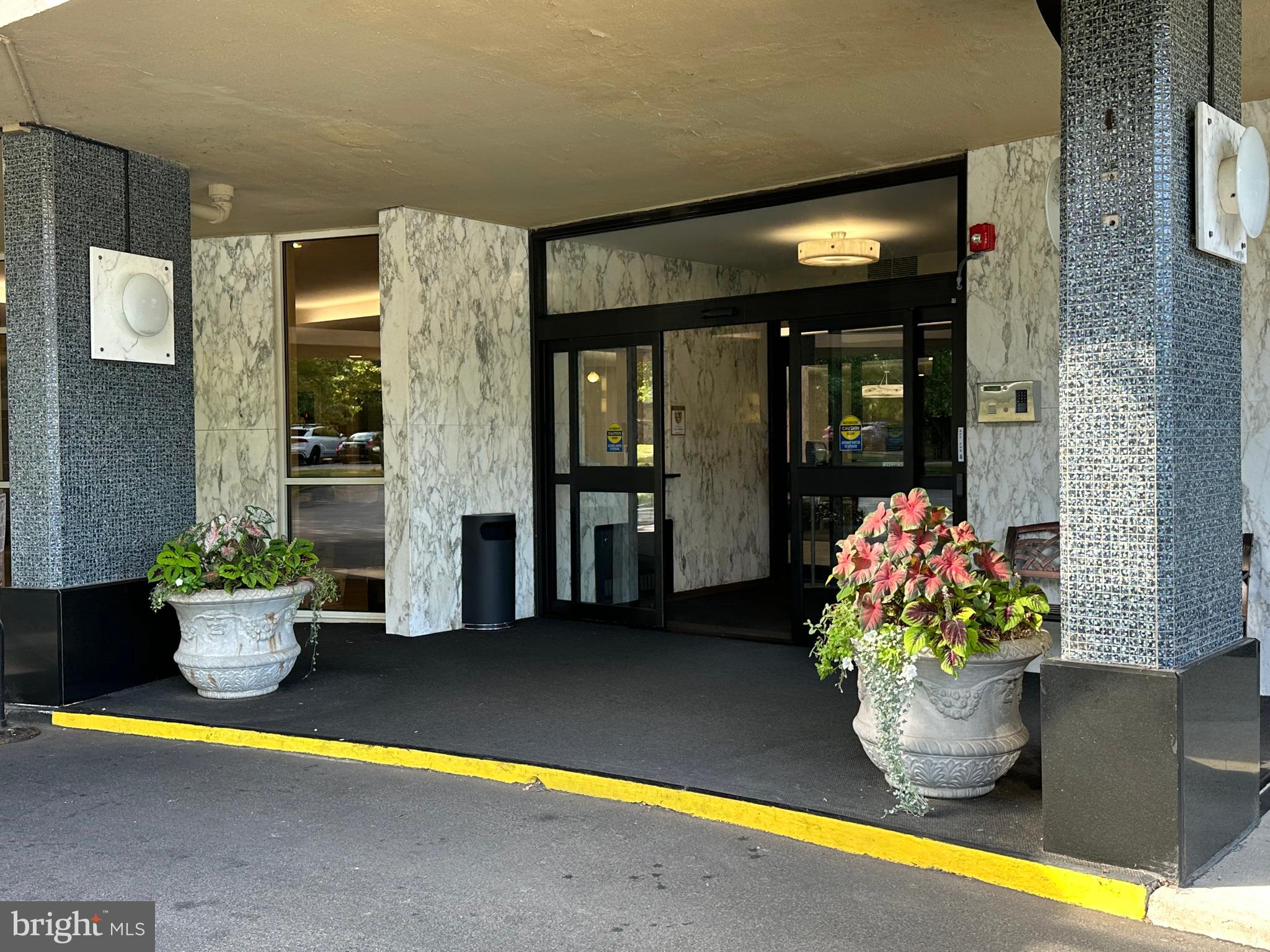 Welcome to Sutton Terrace, one of the best managed condominium buildings in the area! (My humble opinion!) This 1322 square foot 1 bedroom den (legal description) which is often used as a 2 bedroom condo has 1 ½ baths and was reconfigured to enhance the usage of the condo. The entry way was opened so that as you step into the property, there is a wide open space in front of you allowing you to see the entire wall of windows and views beyond. The gleaming dark wood floors are the perfect backdrop for elegant rugs. The property was just painted in designer colors and the bedroom/den are newly carpeted with lovely soft neutral color. The handsome black countertops and white kitchen cabinets in the kitchen floorplan were redesigned to maximize the efficient use of the space. The slight curve and the way it is contiguous to the kitchen gives the dining area character. It has a window for air flow on nice weather. The wall scones and dining room fixture provide subtle, soft lighting. There is a gracious flow of the dining room into the living room. The long end of the living room can be used as another sitting area or a dining area. The view from this 9th floor allows you to see over the treetops and the city in the distance. Take the hallway to the left, the den is then on your immediate right with a full closet. The hall continues to a linen closet on the right and a big walk in closet on the left. The wash/dryer is on your left. As you walk ahead, the angled door to the bathroom leads to the enlarged bathroom. The long vanity and counter have plenty of storage. Look at that beautiful glass wall in the enlarged shower! This shower is easy to use and has so much space. The primary bedroom is roomy and has another wall of windows. The library and fitness center are on the first floor. The newly redecorated social room is used for meeting, speakers, playing cards and games and entertainment. The grounds have lush plantings and are well kept. A beautiful new fence was installed around the perimeter of the lot. The location of the building has easy access to the city, suburbs and airport. Shopping is right across the street. It is a beautiful neighborhood to live in with charming homes nestled close to mature trees and plantings. This building has so many people who love living here. The pool is open to everyone for a $145 per member. The indoor garage spaces when available are $140/month. There is a $2500 refundable move in fee after living at Sutton Terrace for 30 months. The condo fee is $1203/month which includes $879 monthly association fee + capital reserve fee of $143 + masonry loan of $146 until 2/28 estimated and $35 for electric.