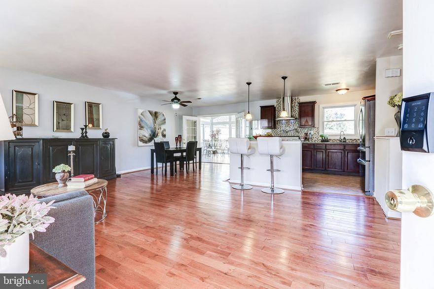 Great value!  45 day closing is ideal. Great opportunity to own a single family home at a townhouse price. Open & bright floor plan  w- Large lot with fenced yard. No HOA fees! Amazing Sunroom off  beautiful New kitchen- Newer Roof- New Windows. NEW A/C & Furnace. NEW Stainless Steel Appliances. NEW Paint. No walls between kitchen, dining, living. Large kitchen island & granite counters.  Gourmet features in kitchen- Pot filler over stove,  granite and more. Hardwood through main & upper levels. Ceramic tile flooring in kitchen & bathrooms. Double sink and granite counters in master bath. Lower level is ideal  for family gatherings or  perfect private rental -  it offers family room with fireplace, bonus room for 4th bedroom, full bath, kitchenette, laundry, walkout to  private yard . Oversized 2-car garage. Convenient location close to 28, 7,  toll road, airport, parks, shops, restaurants, & W&OD Trail.