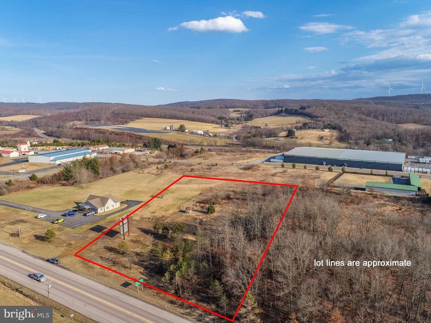 Commercial use land! 3.57 acres located along Maryland Highway Rt. 135! Close to town and other thriving local businesses. High daily traffic count and high visibility.  Mostly level and easy to build on. Public water and public sewer hook-ups available. Adjacent to local business park. Designated Maryland Opportunity Zone and Growth Area. Also conveys with an income producing billboard too!