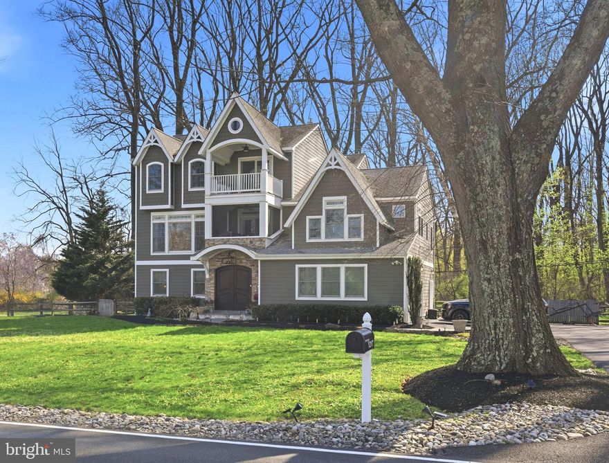 This turnkey property built in 2010 offers impressive river views and a range of quality features. Set back from the road, the residence welcomes you with elegant mahogany front doors that introduce the refined style throughout. The main level serves as an ideal guest suite, comprising a living area, dining space, kitchenette, and full bath, with direct access to the yard for added convenience. Access the primary living quarters via stairs or a new elevator, where a spacious family room with a large picture window highlights the river scenery, complemented by a gas fireplace and built-in cabinetry. A screened balcony provides a peaceful retreat surrounded by nature with the river as the most special backdrop. The gourmet kitchen is equipped with new appliances, ample cabinetry, and a dining area opening onto a generous composite deck with awning and wooded views. This floor also includes a study, a bedroom with river views and a full bathroom and a tucked away powder room. Upstairs, there are 2 bedroom suites, including a distinguished primary suite featuring a gas fireplace, private balcony overlooking the river, and a luxurious full bath. Additional amenities include a fully finished walk-up lower level, a three-car garage with epoxy flooring, a new generator, a new water heater, and across the street, new steps leading to the water with an extended patio, a perfect place to read, fish or launch water toys. The property offers a tranquil sanctuary while providing easy access to Washington Crossing Park, the bridge into New Jersey, the I-295 corridor, and the downtown areas of Newtown, Yardley, and New Hope for all of your shopping, dining and entertainment. One of a kind in Upper Makefield Township!