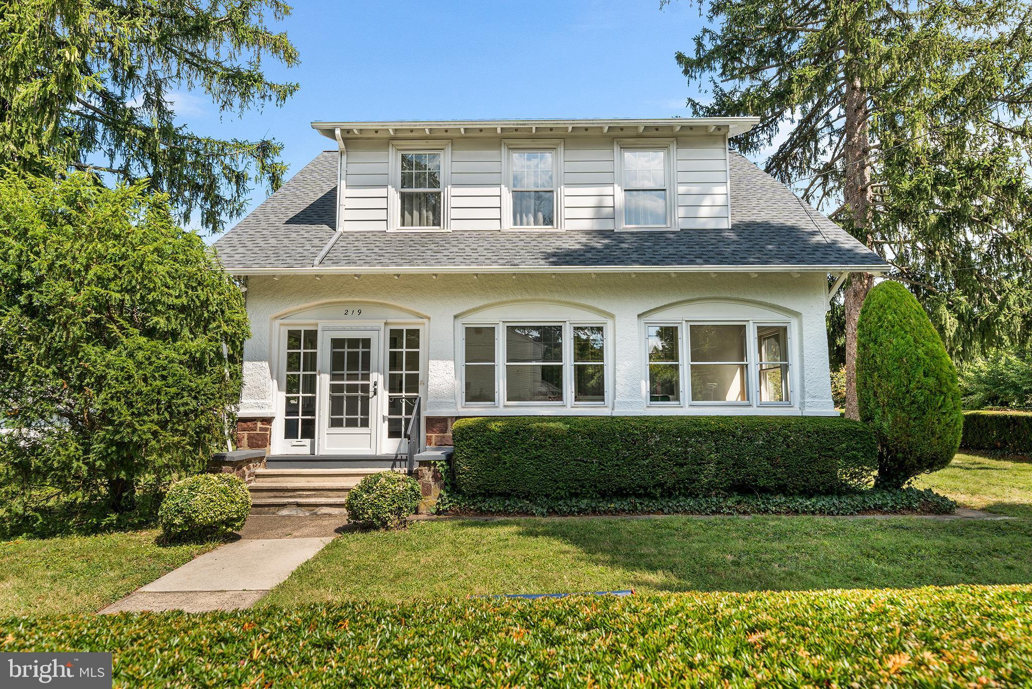 Classic Colonial on Corner Lot. This well-maintained Colonial sits proudly on a spacious corner lot, offering timeless charm and modern convenience. Enter through the inviting enclosed front sun porch and step inside to find high ceilings, original woodwork and doors, and generously sized rooms throughout, including 3 bedrooms and 1.5 baths. A welcoming mudroom off the side entrance and a full unfinished basement provide added flexibility and storage. The property also features an oversized garage with additional storage building and an attached greenhouse, perfect for hobbyists or gardeners. Enjoy the unbeatable location—just a short walk to local restaurants, shopping, and the train station. A wonderful blend of character, comfort, and convenience—this Colonial is a true gem!